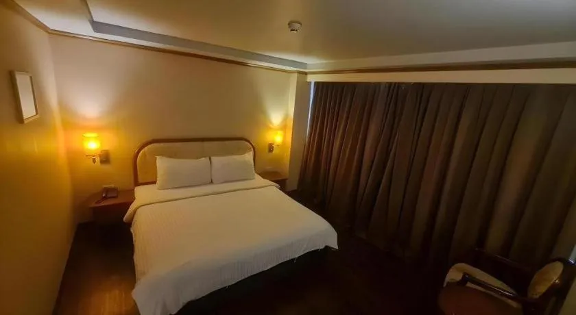 Bed in Western Grand Hotel Ratchaburi