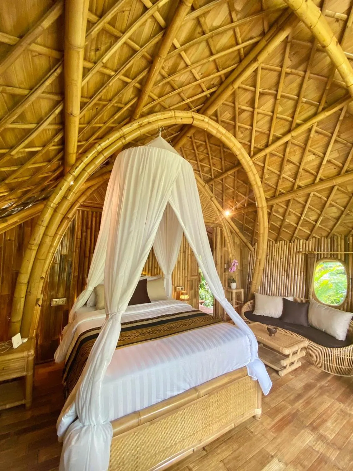 Bed in Arcada Bali Bamboo House