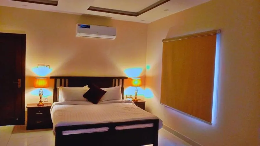 Photo of the whole room, Bed in Gulberg Suites