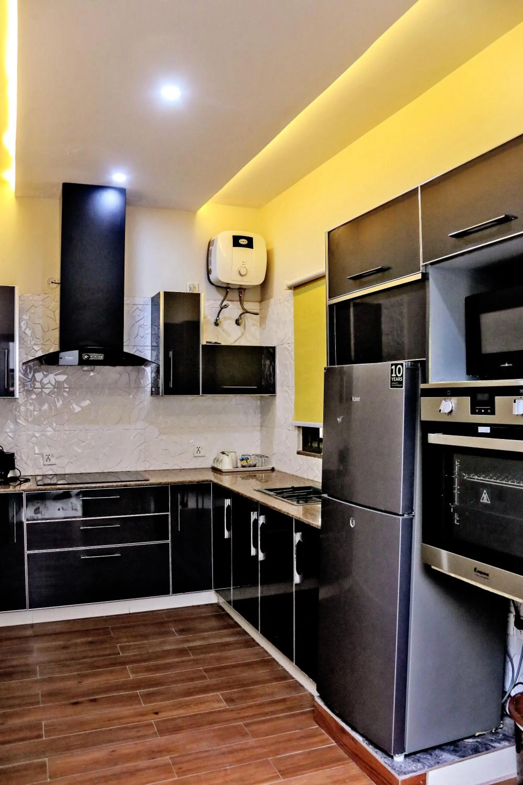 Kitchen or kitchenette in Gulberg Suites