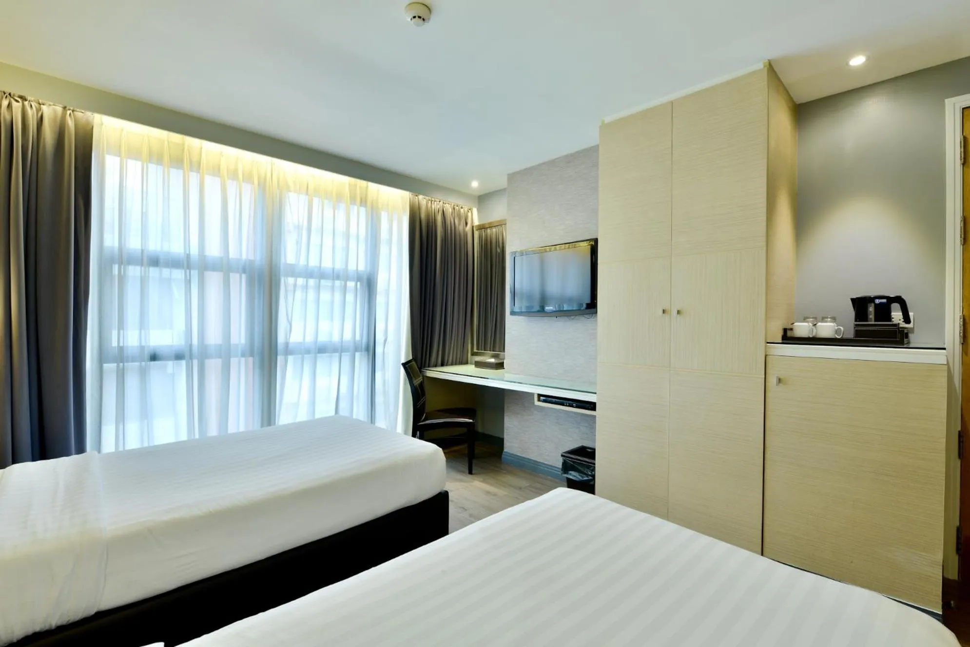 Bed in Prestige Suites Nana