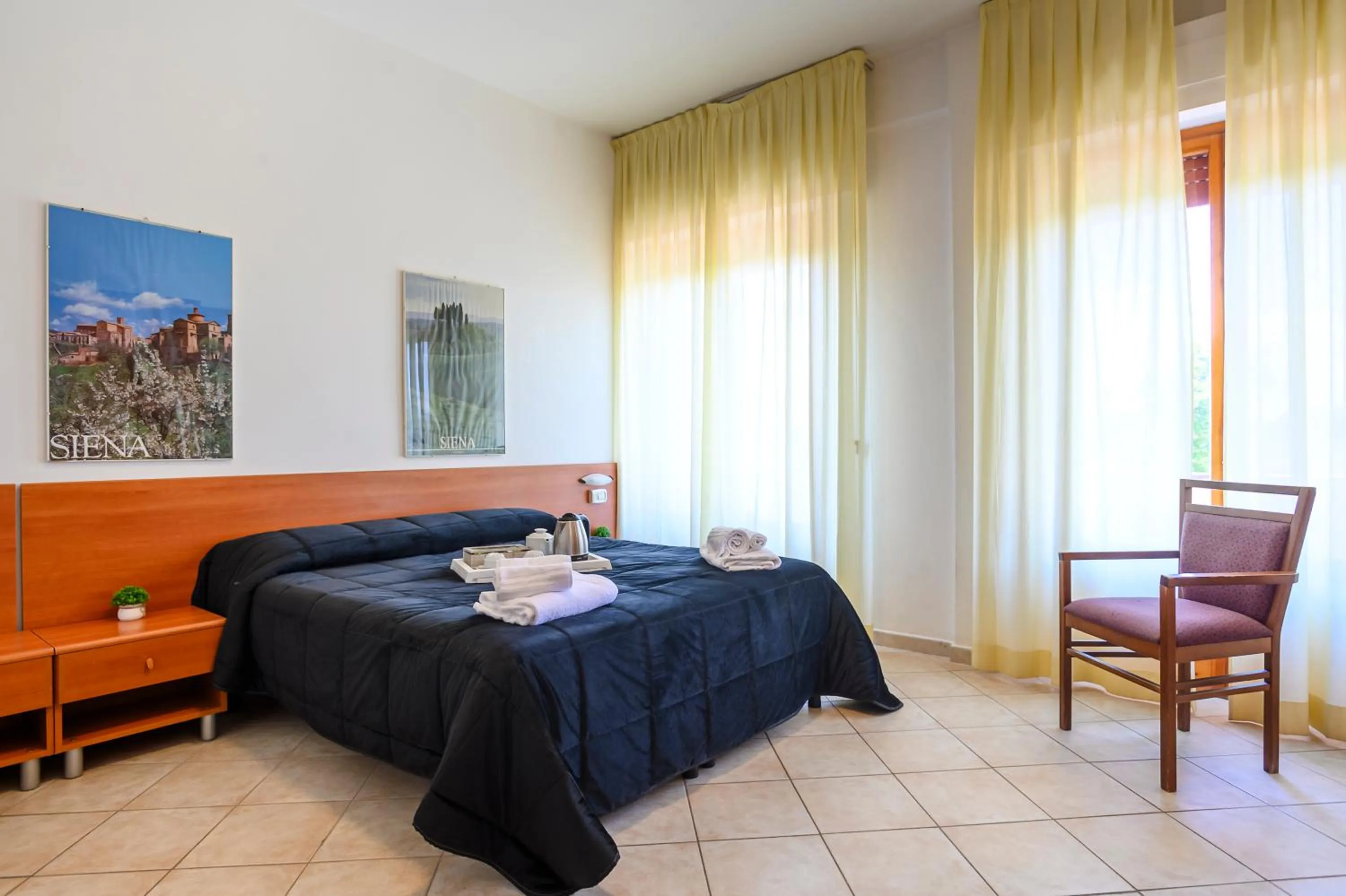 Decorative detail, Bed in Hotel Vico Alto Siena