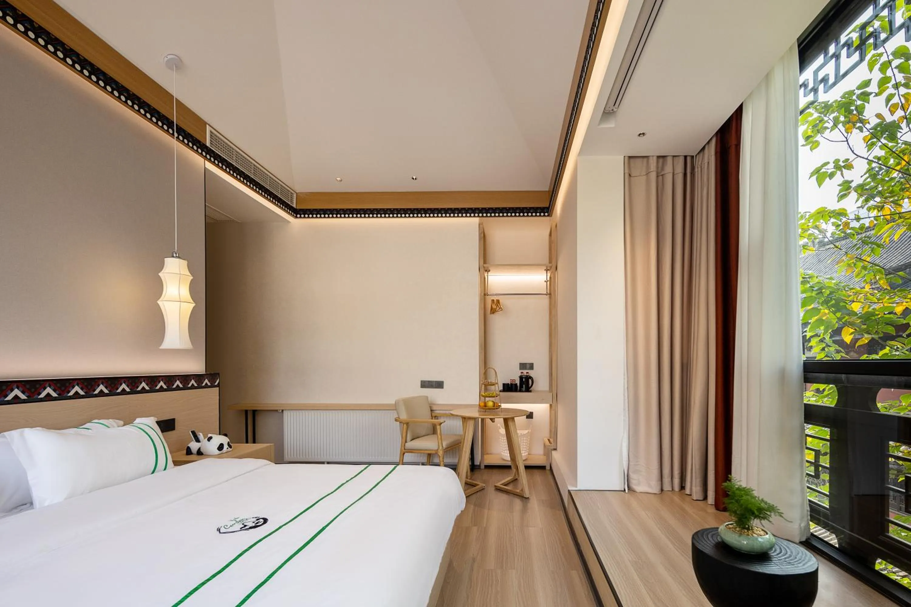 Bed in Xishu Garden Inn - Travel Agency service - Car Rent service - English Speaking