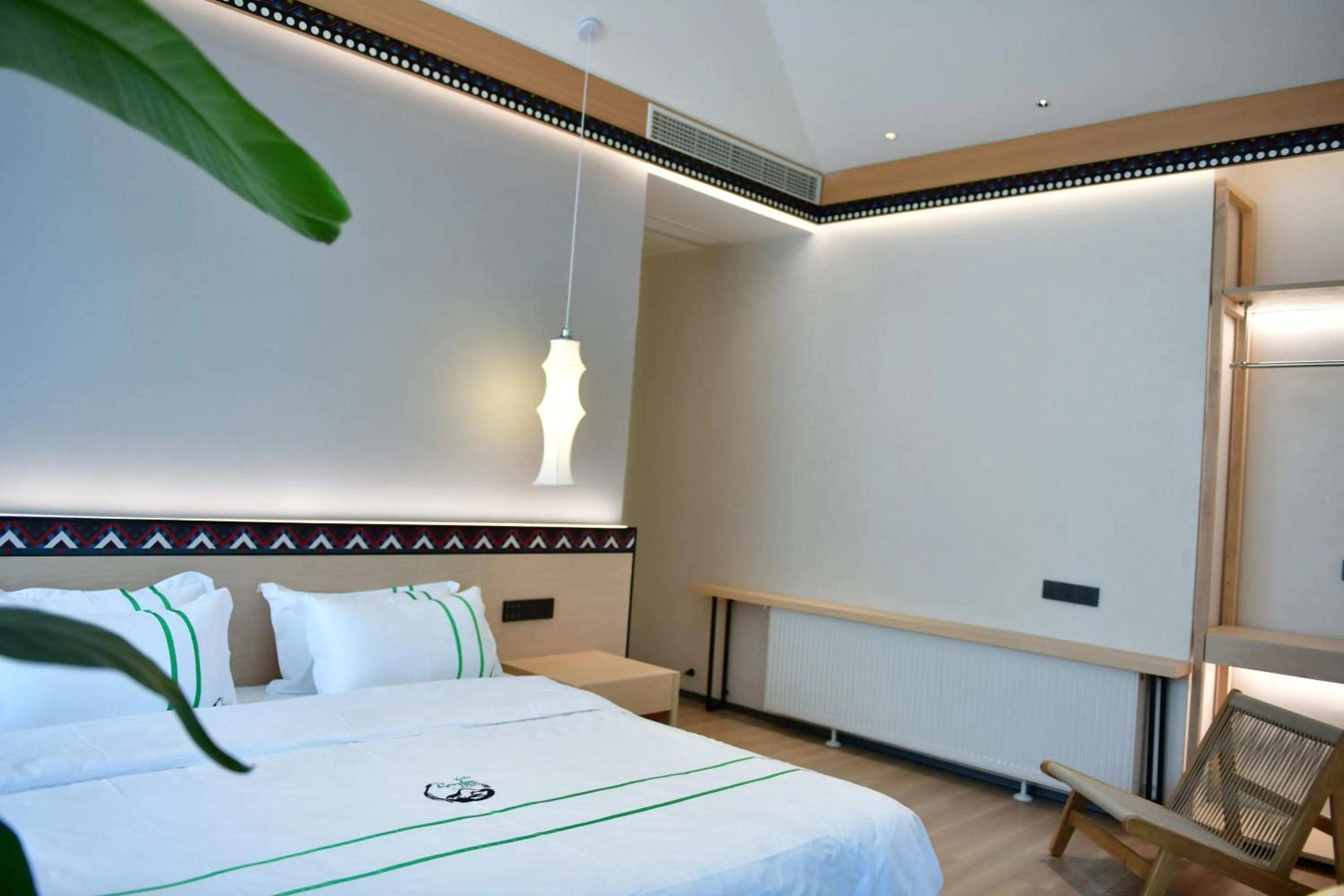 Photo of the whole room, Bed in Xishu Garden Inn - Travel Agency service - Car Rent service - English Speaking