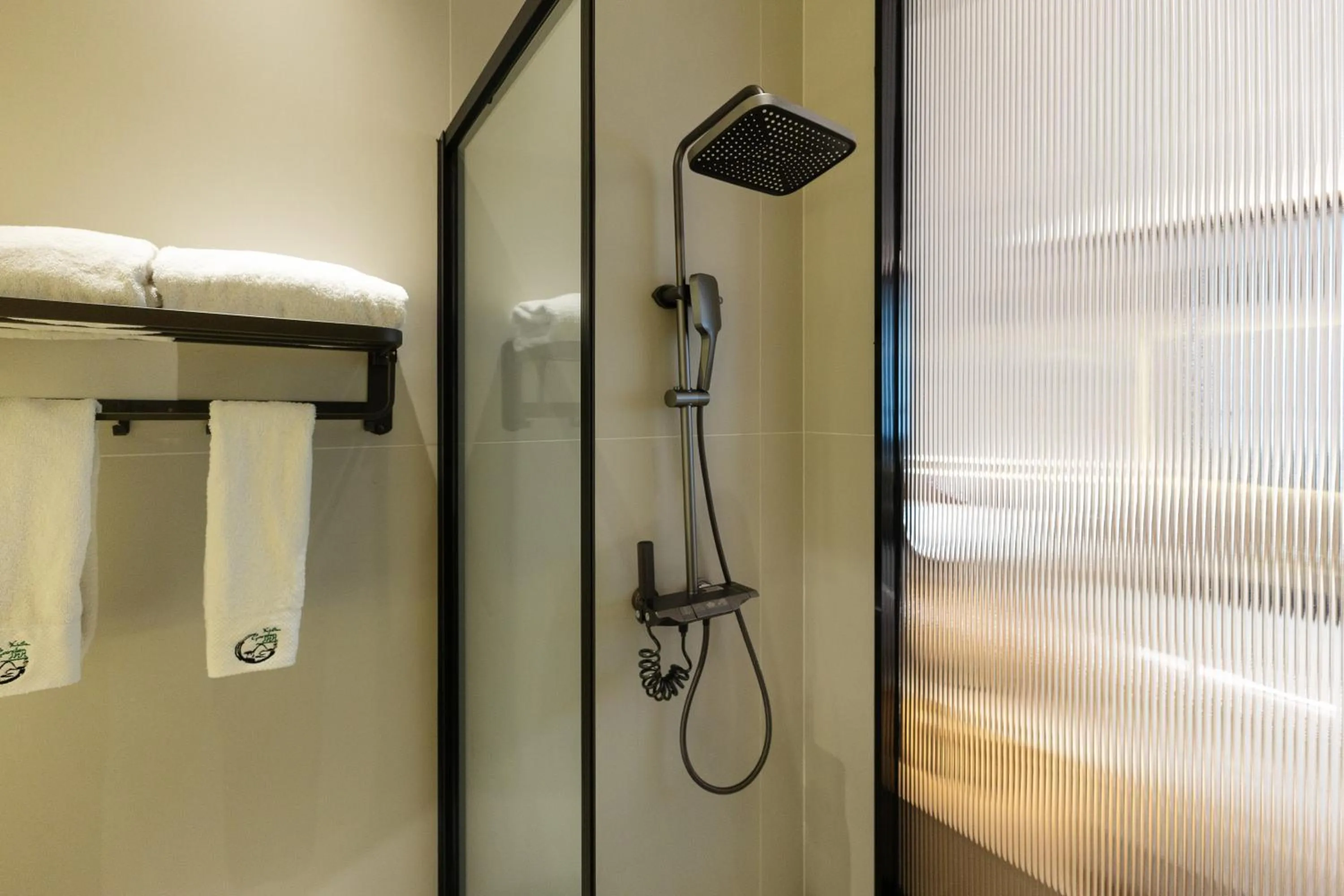 Shower in Xishu Garden Inn - Travel Agency service - Car Rent service - English Speaking