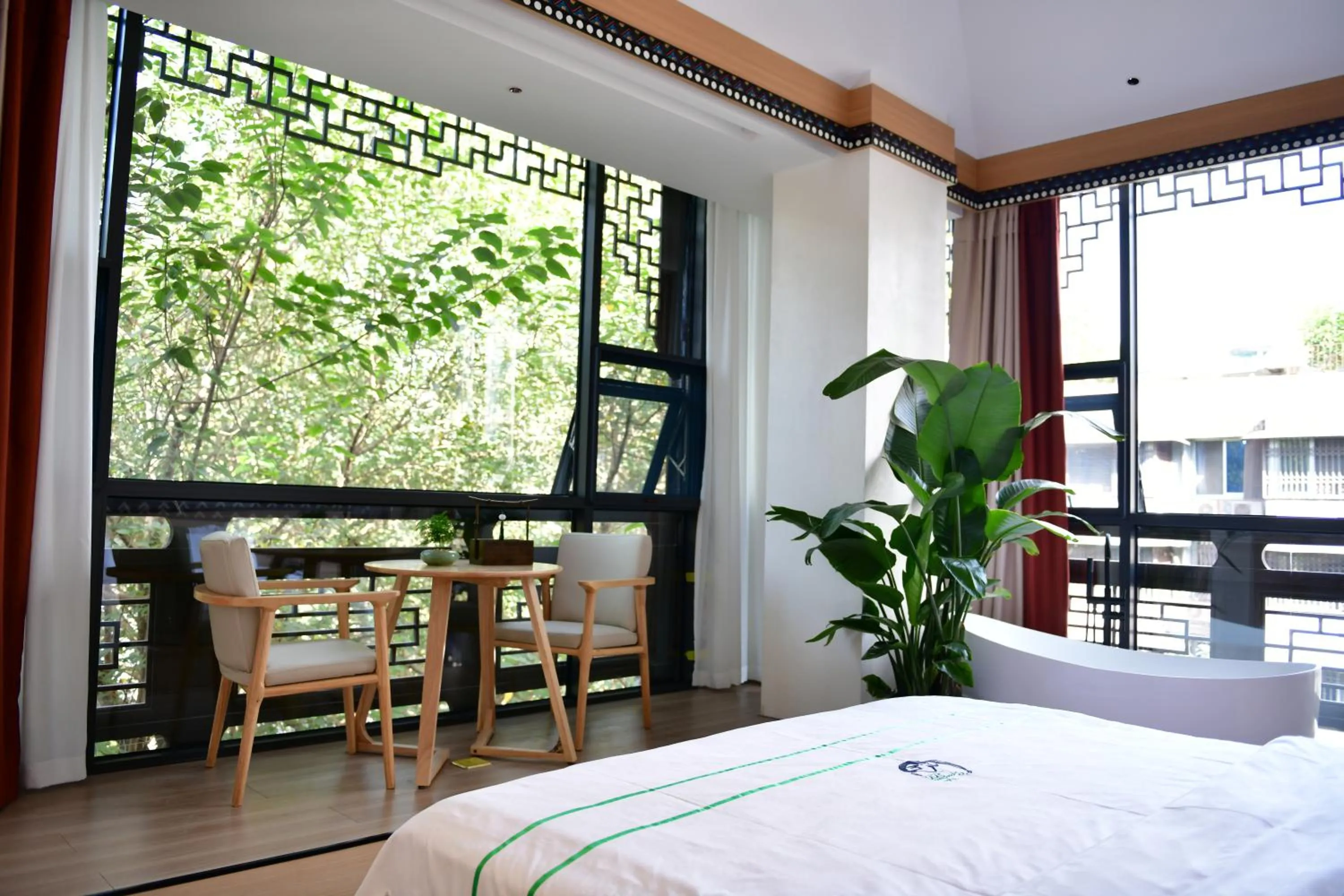 Photo of the whole room, Bed in Xishu Garden Inn - Travel Agency service - Car Rent service - English Speaking