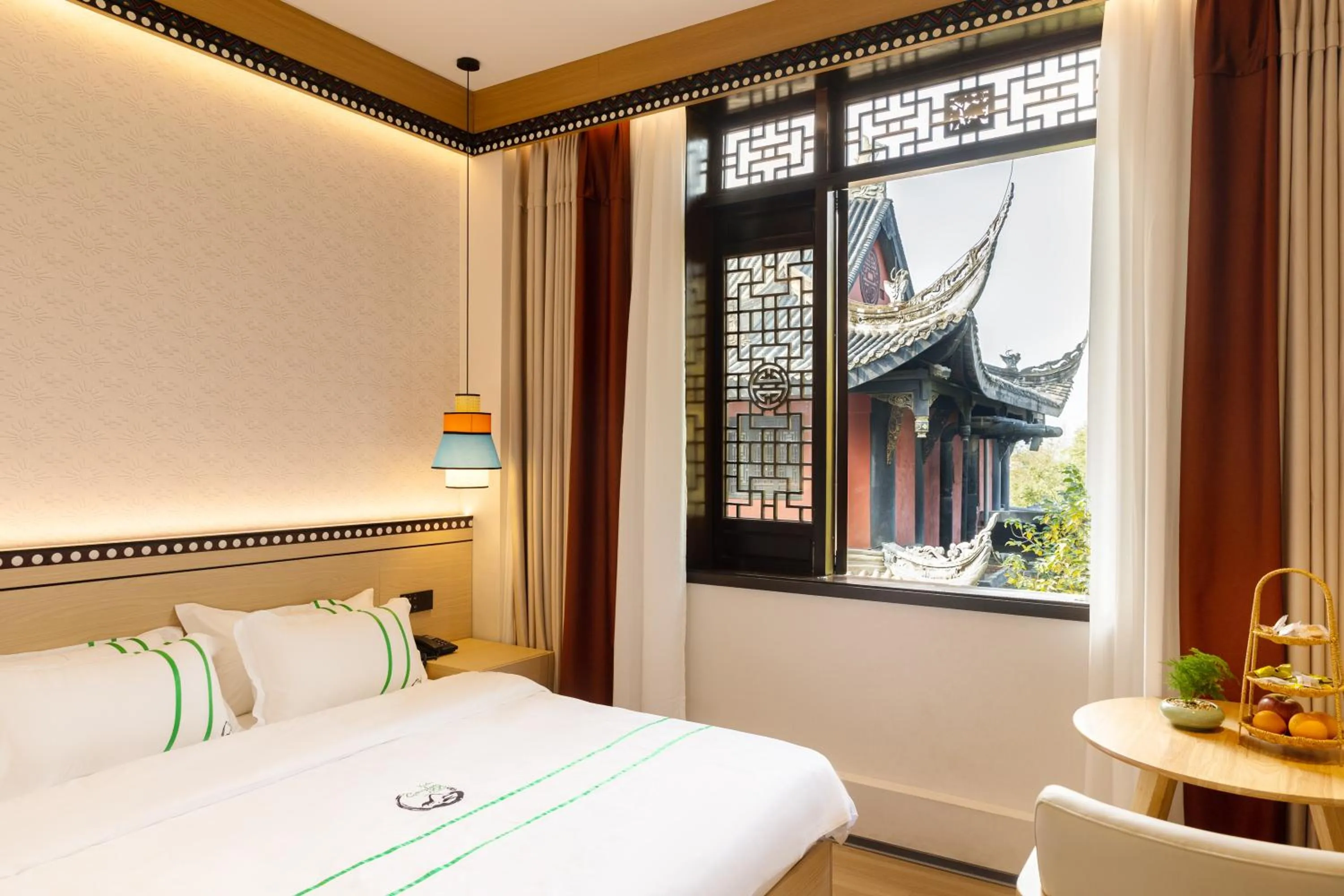 Bedroom, Bed in Xishu Garden Inn - Travel Agency service - Car Rent service - English Speaking