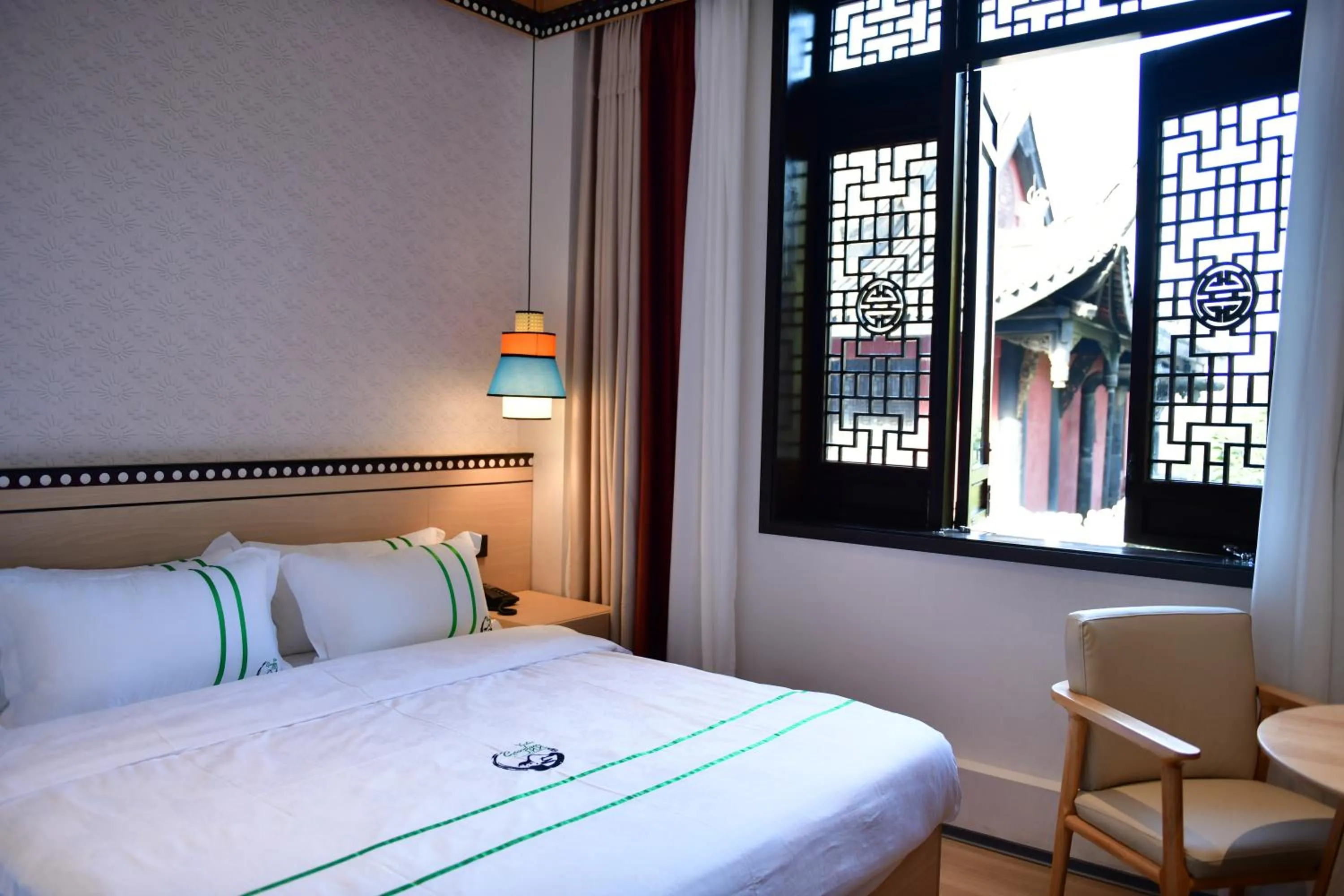 Bed in Xishu Garden Inn - Travel Agency service - Car Rent service - English Speaking