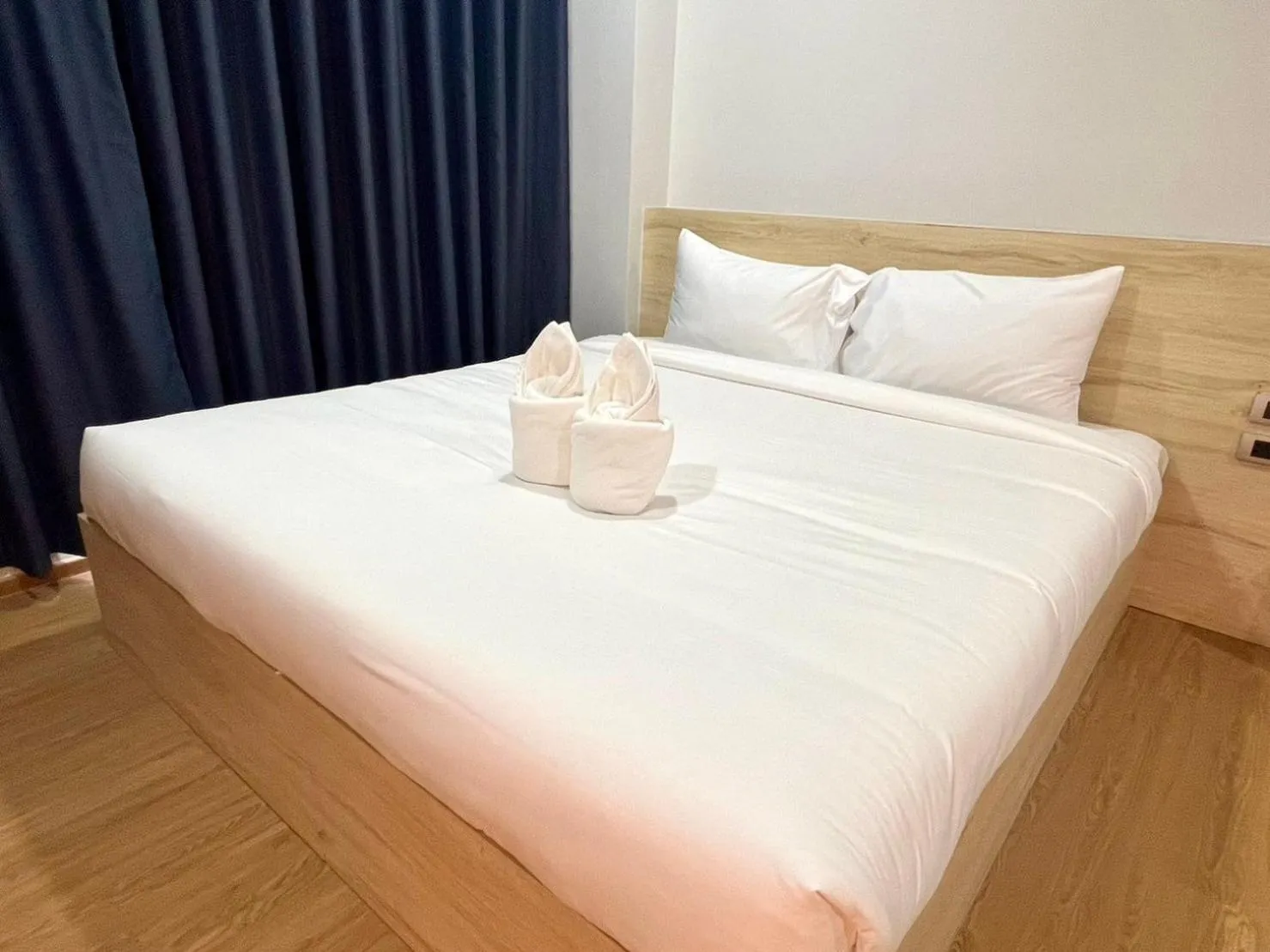 Bed in JIA HAUS Hotel Apartment