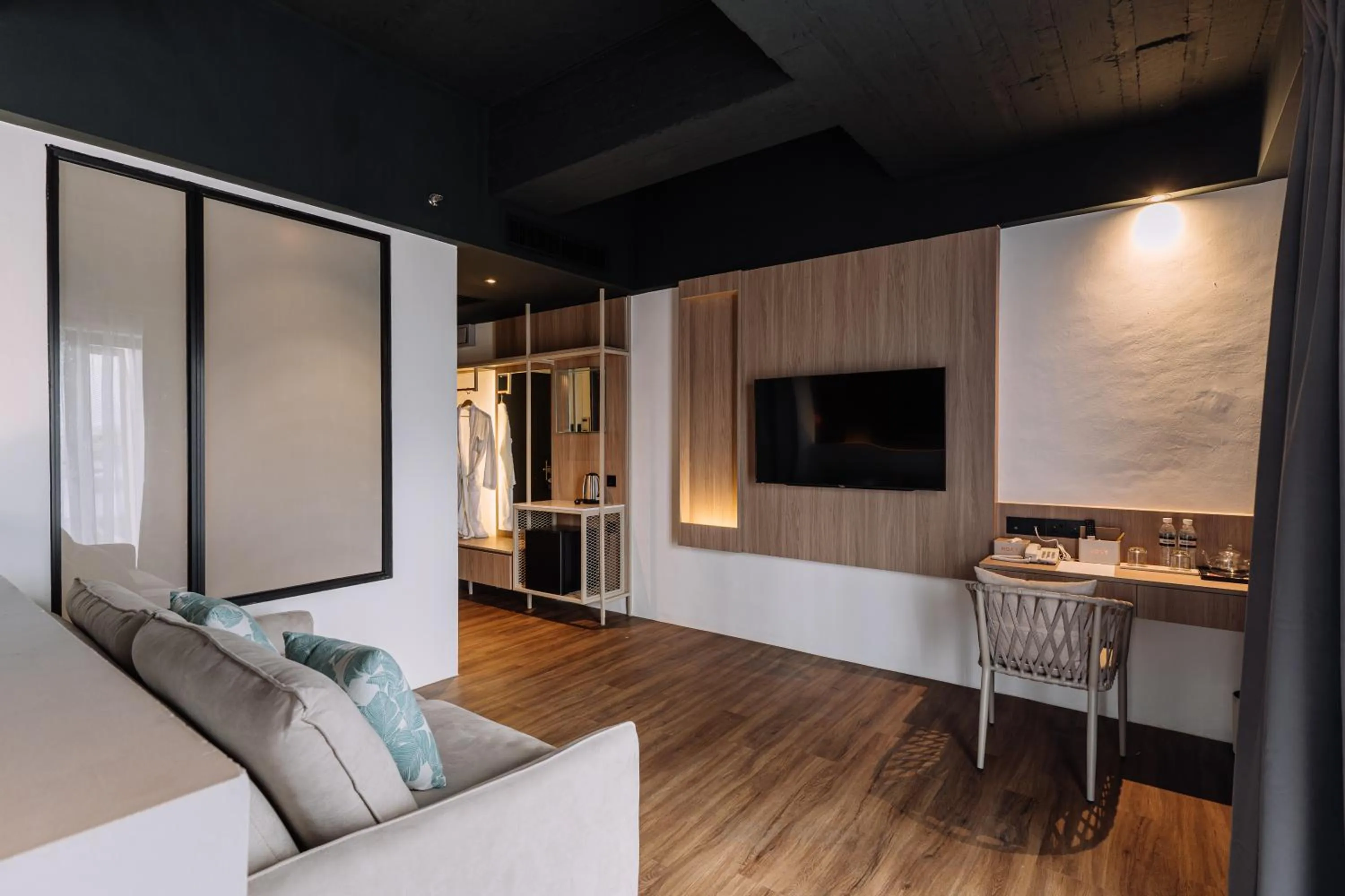 Seating area in Impiana by Roxy Hotel