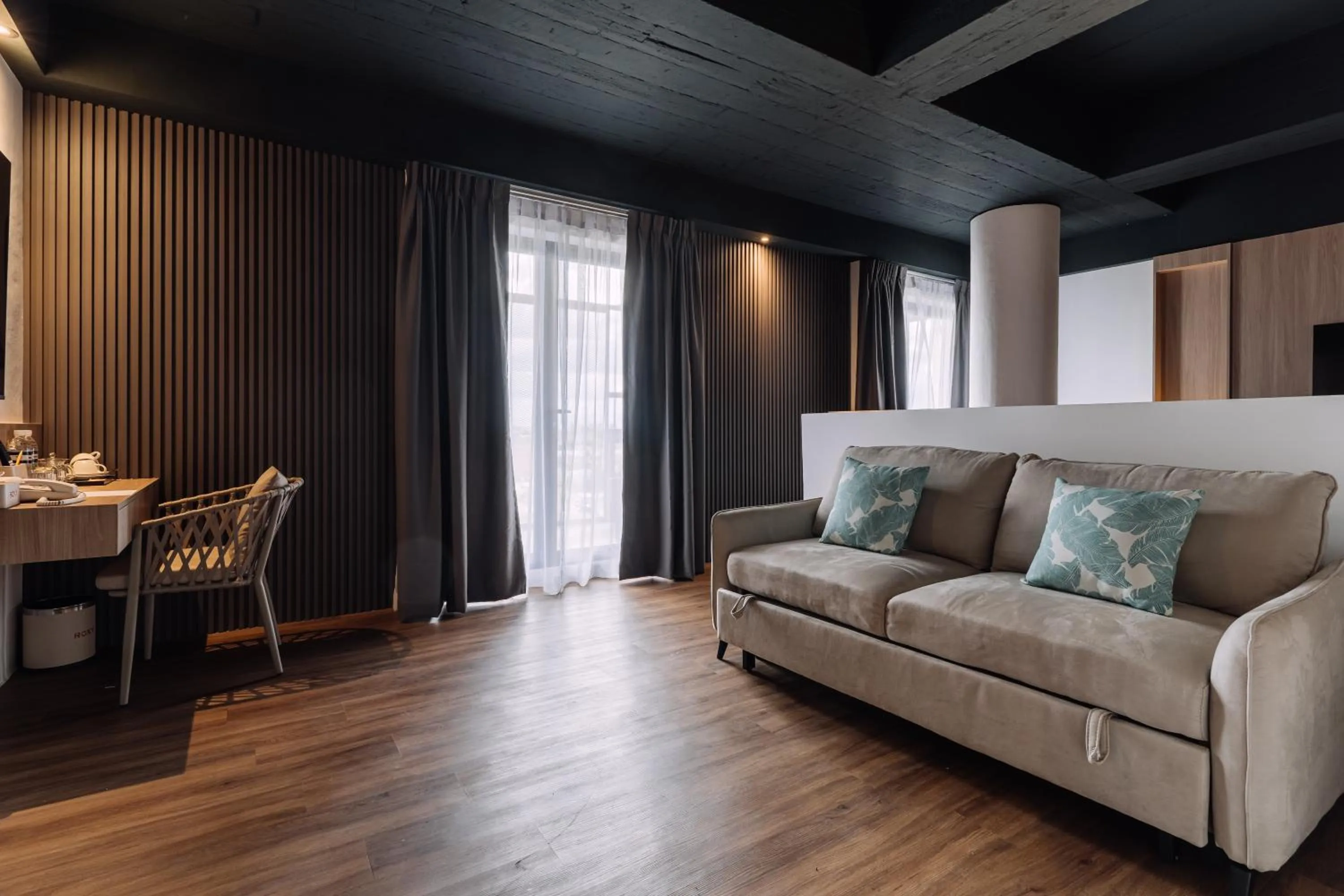 Seating area in Impiana by Roxy Hotel