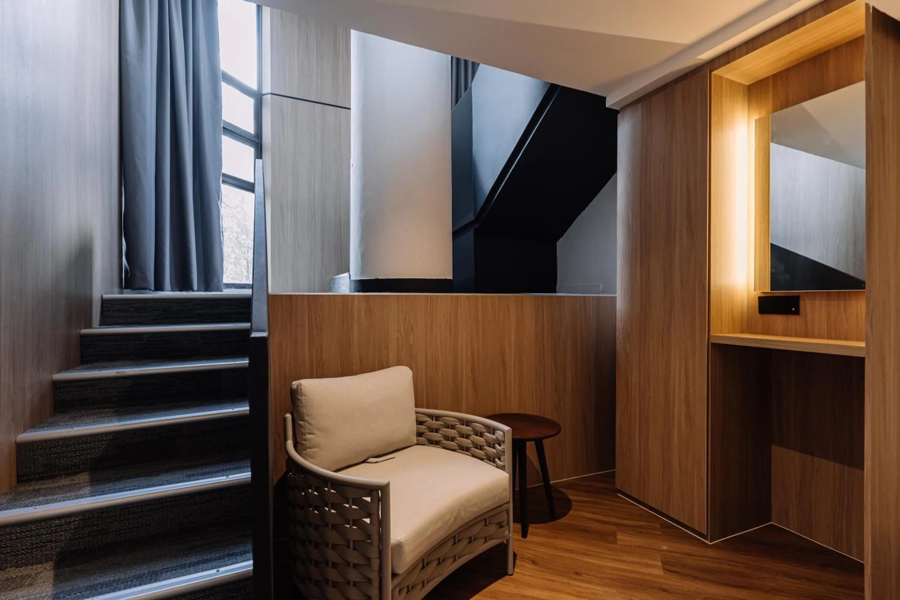 Seating area in Impiana by Roxy Hotel