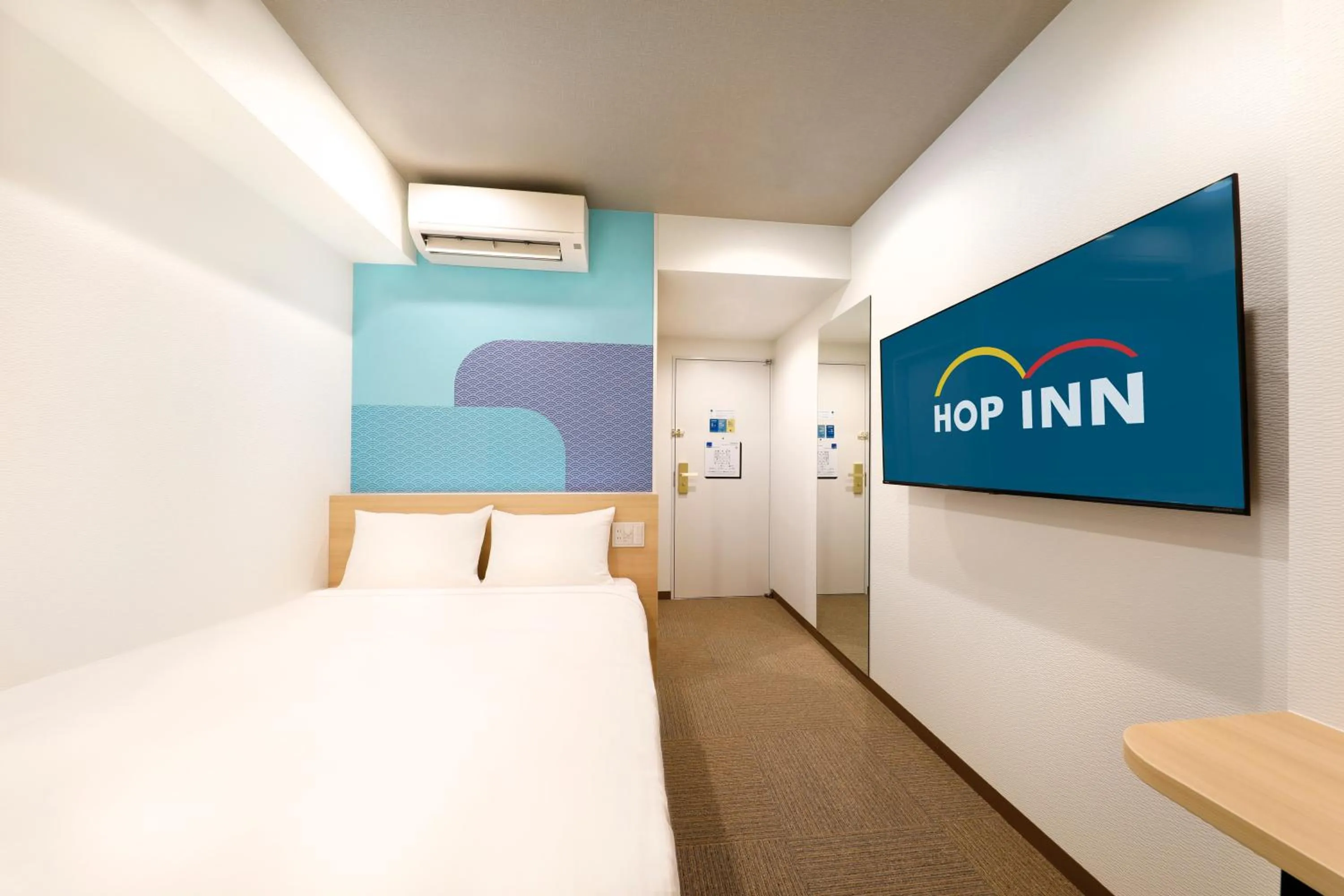 Bed in Hop Inn Tokyo Iidabashi