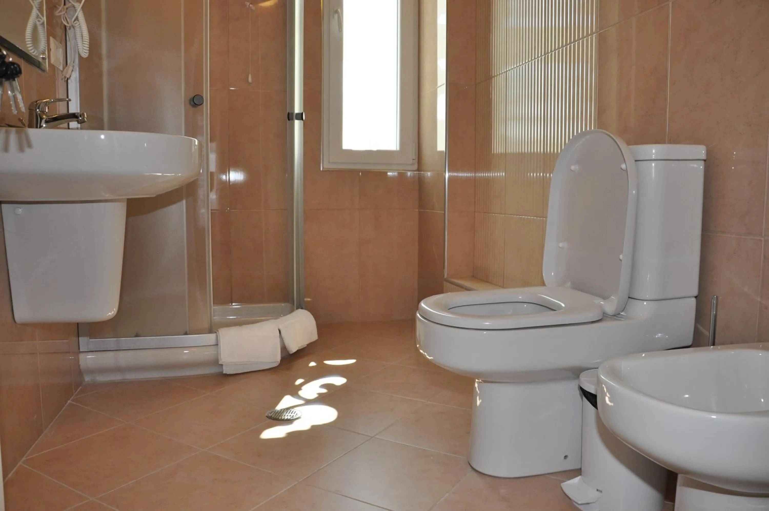 Shower in Grand White City Hotel