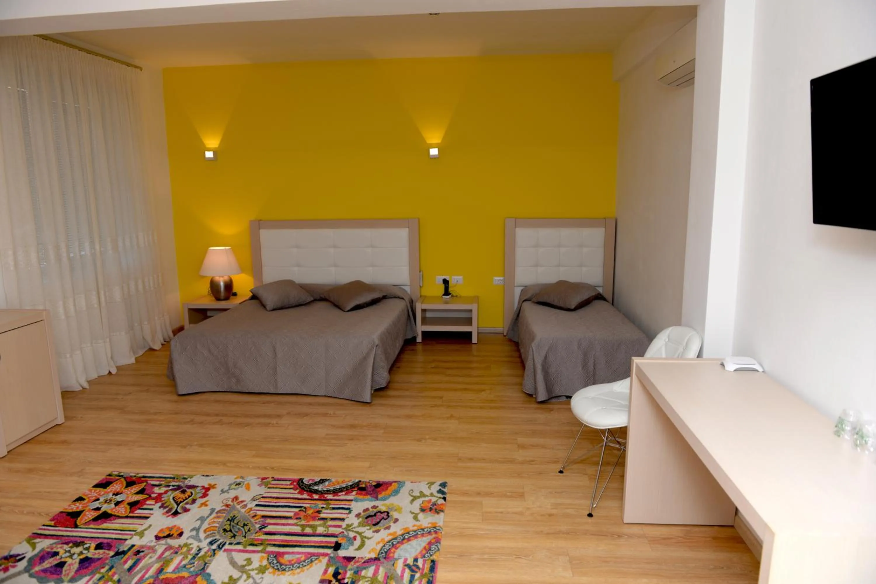 Bed in Grand White City Hotel