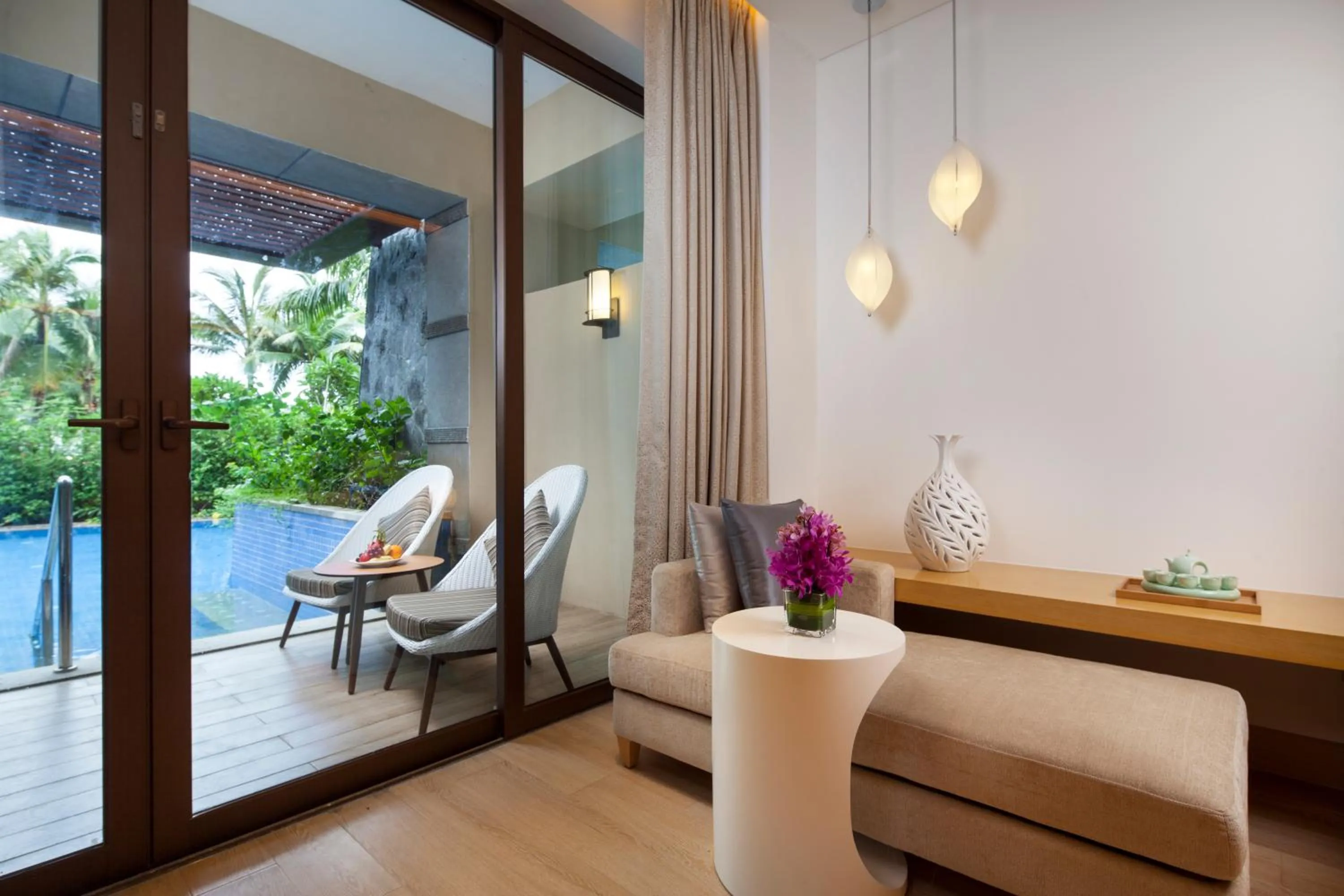 Swimming pool, Seating Area in Sanya Yazhou Bay Resort Curio Collection by Hilton