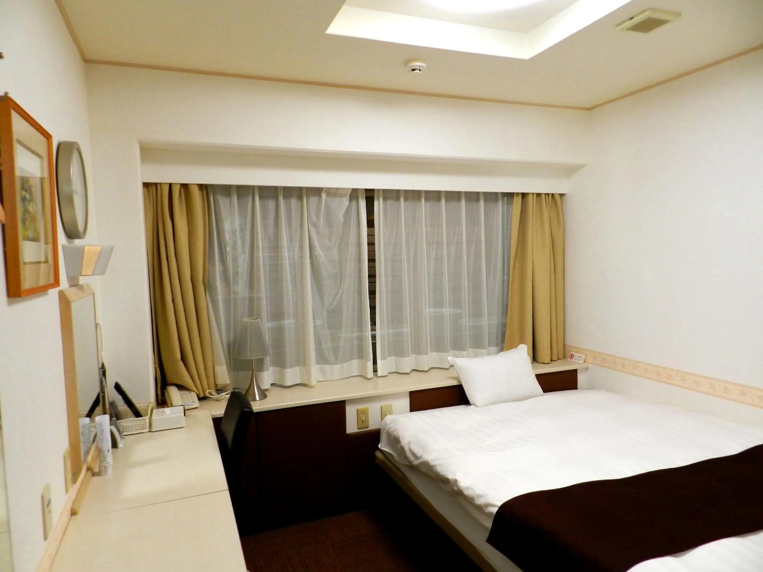 Photo of the whole room, Bed in Check In Matsuyama