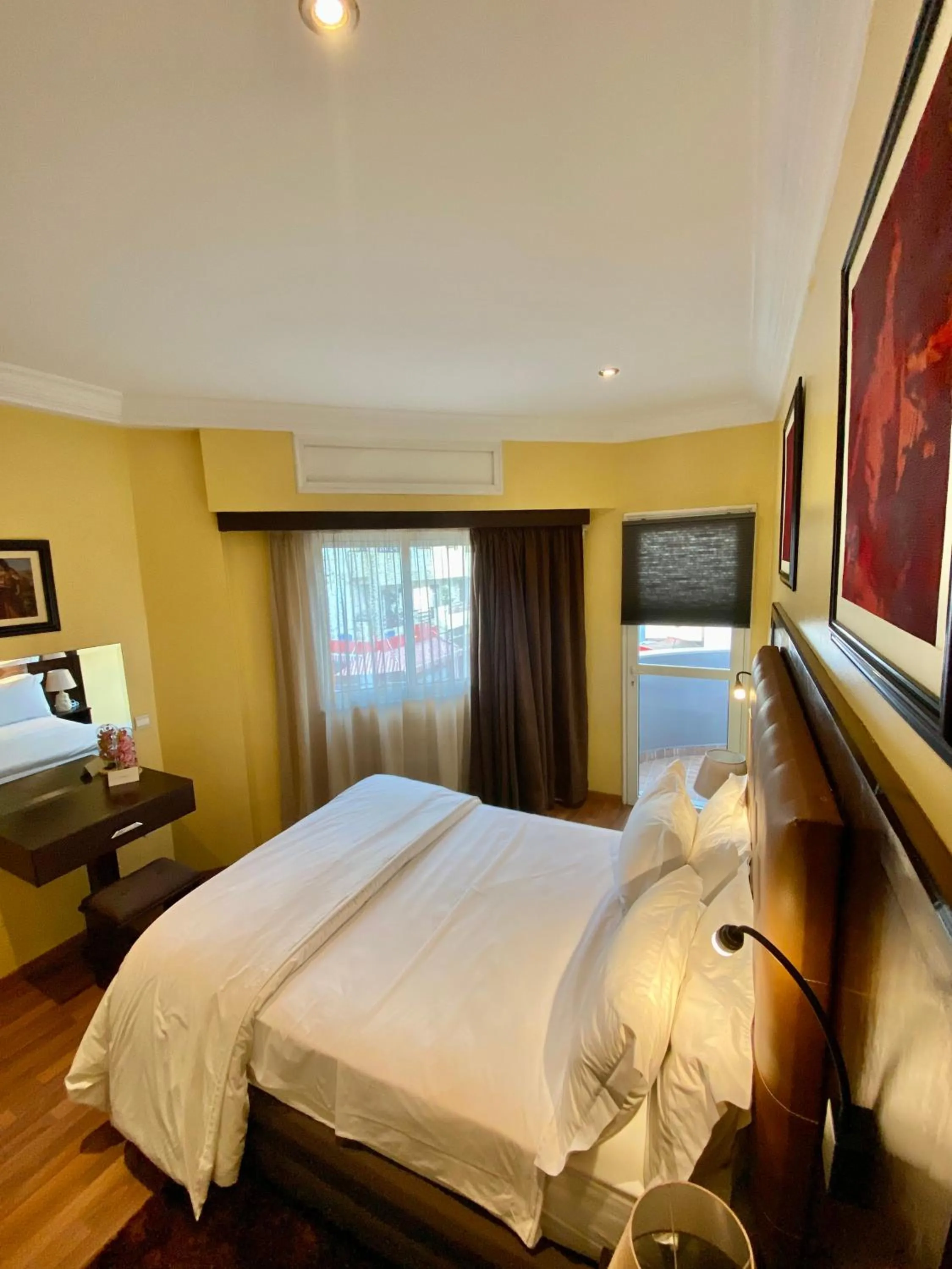 Bed in Appart Hôtel Oleandro