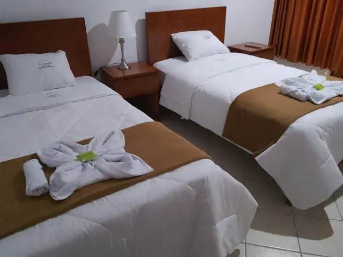 Bed in HOTEL LOS ANDES SUITE