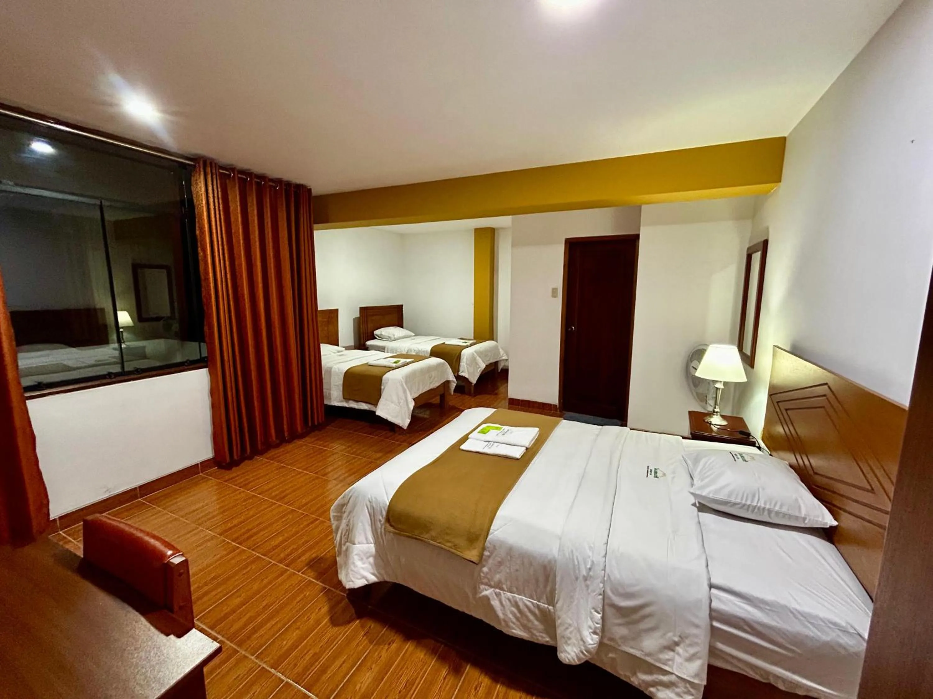 Bed in HOTEL LOS ANDES SUITE