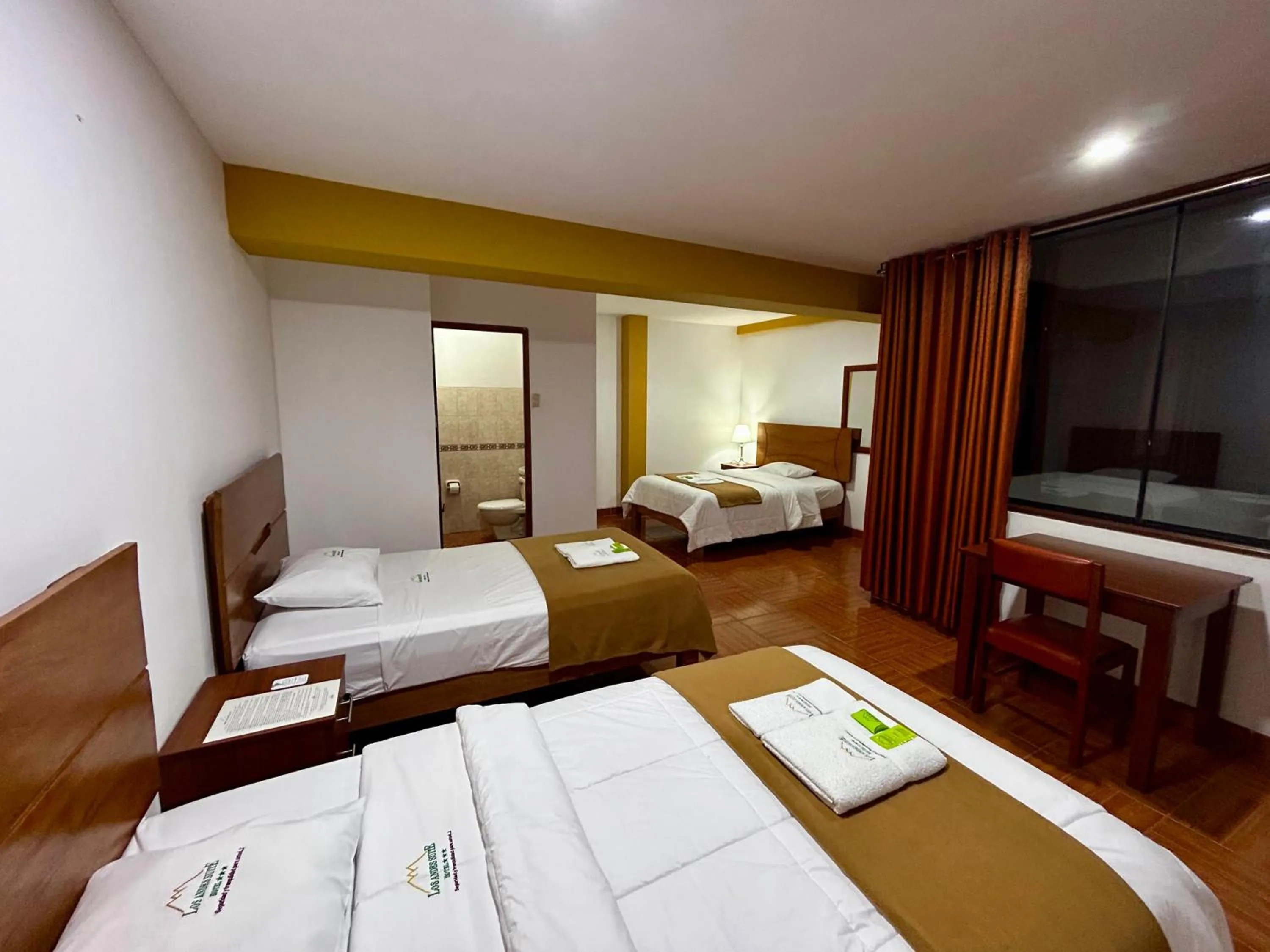 Bed in HOTEL LOS ANDES SUITE