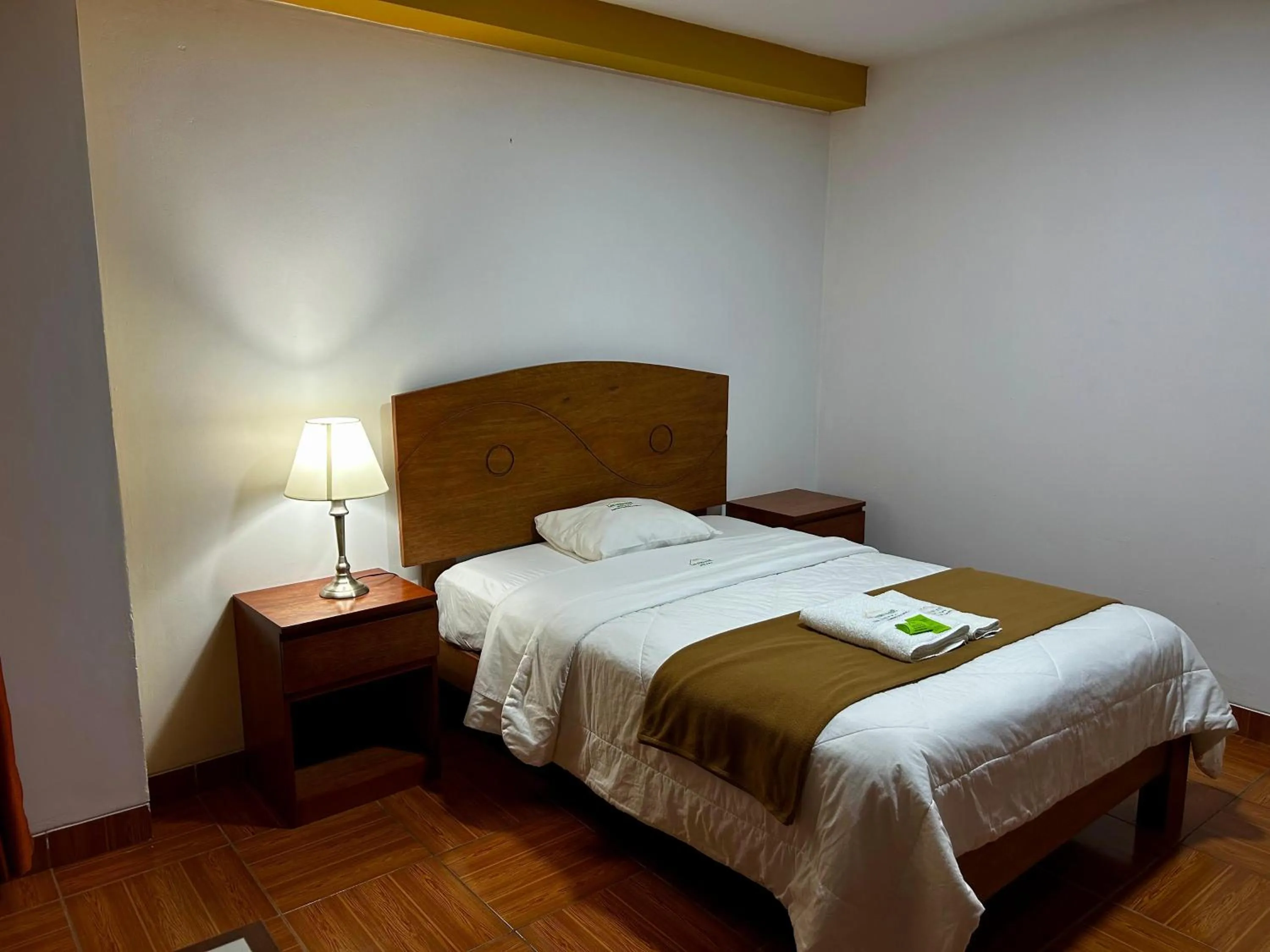 Bed in HOTEL LOS ANDES SUITE