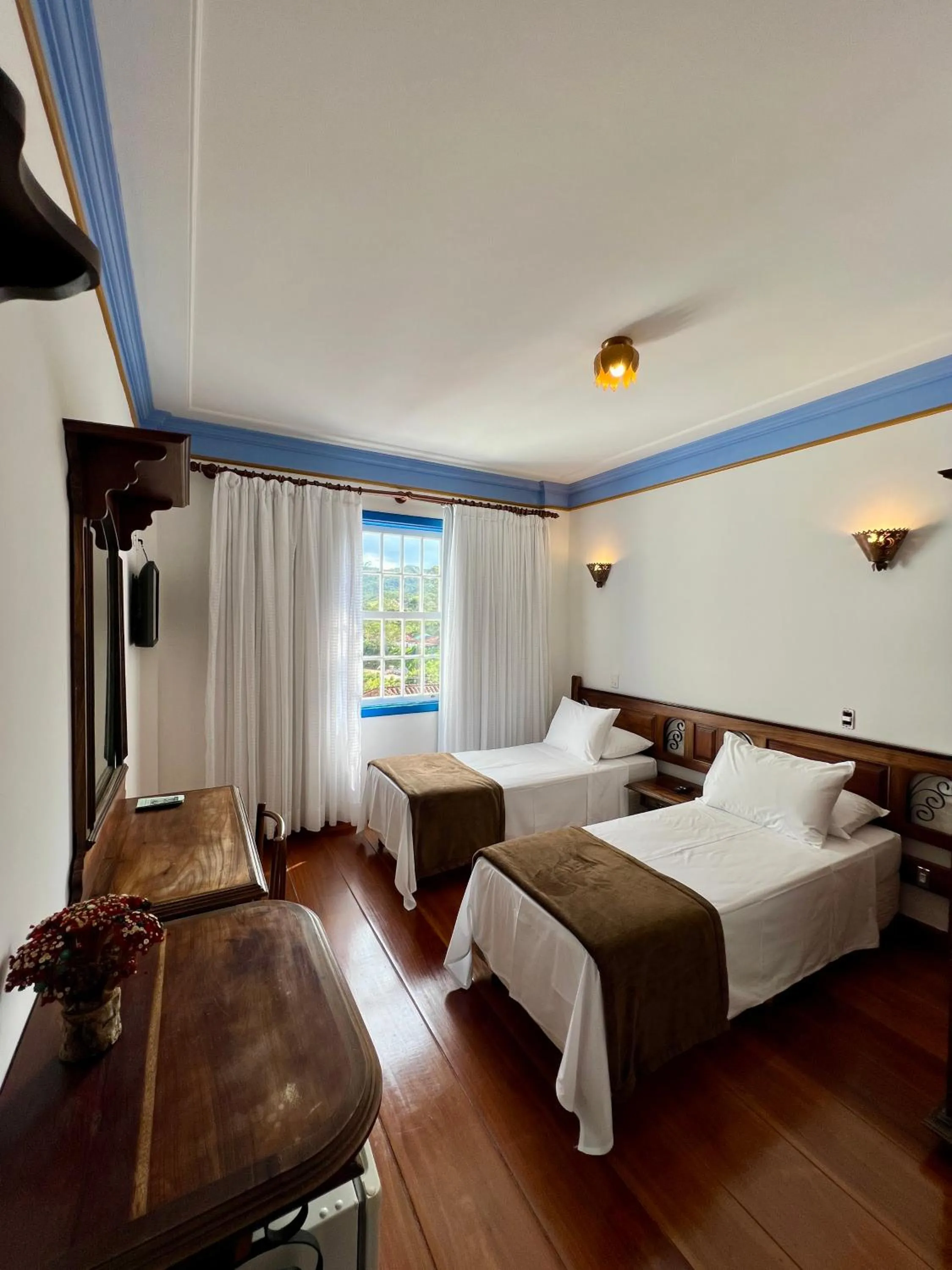 Bed in Pousada Sinhá Olímpia