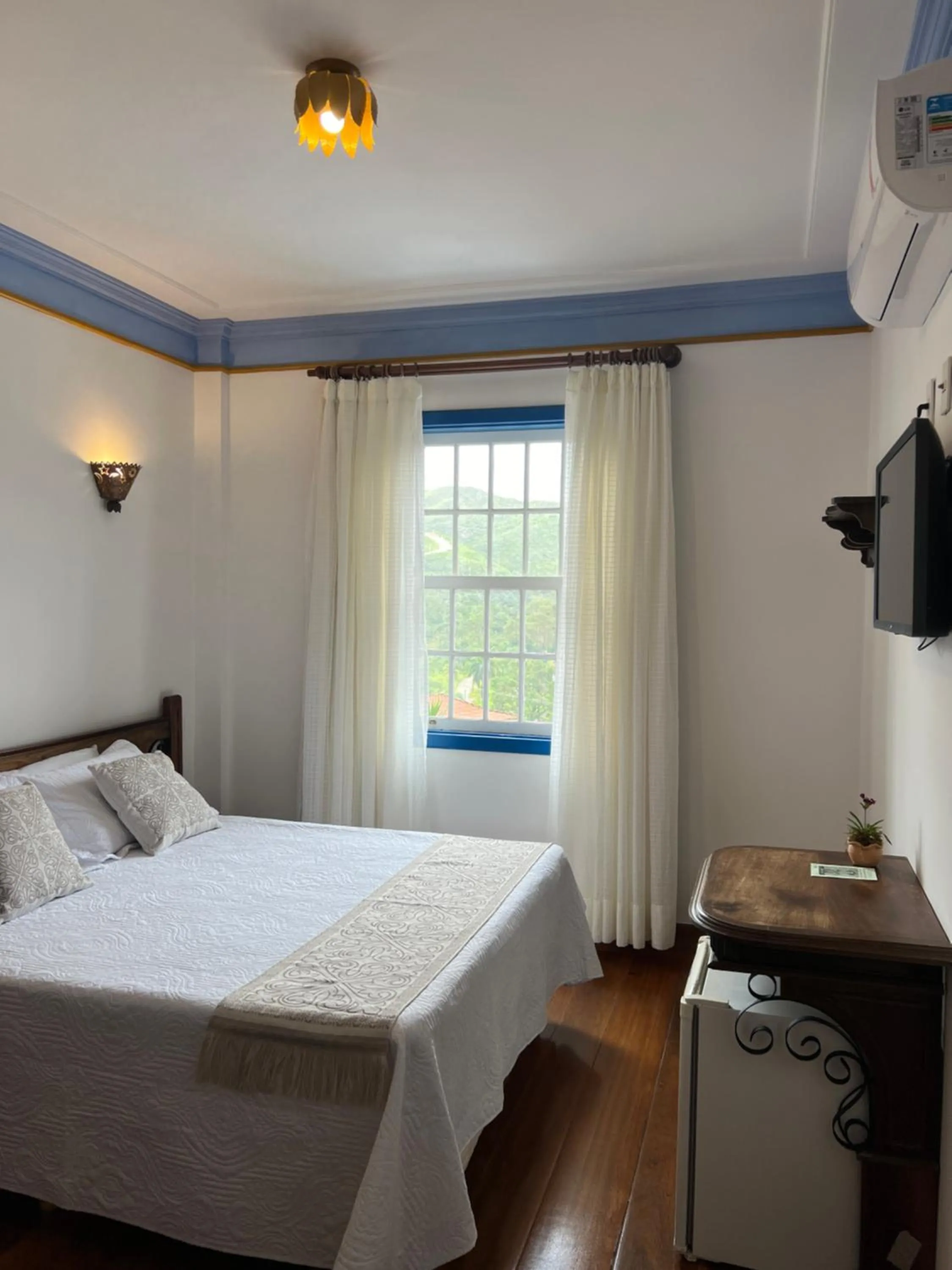 Bed in Pousada Sinhá Olímpia