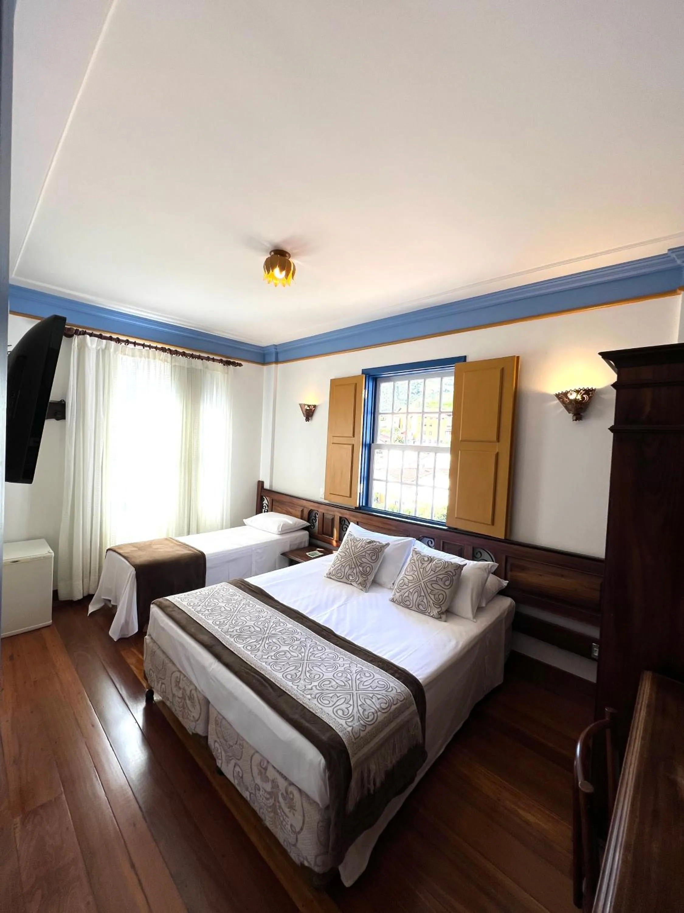 Bed in Pousada Sinhá Olímpia