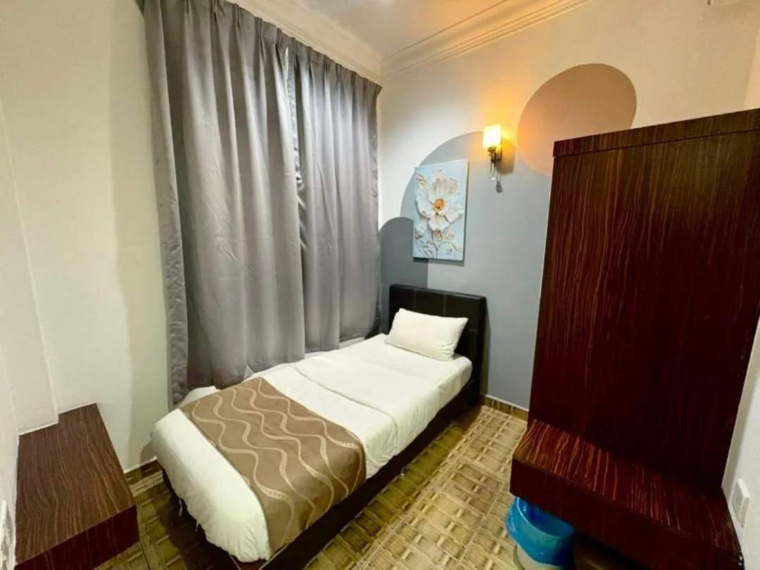 Bed in DAILY INN HOTEL