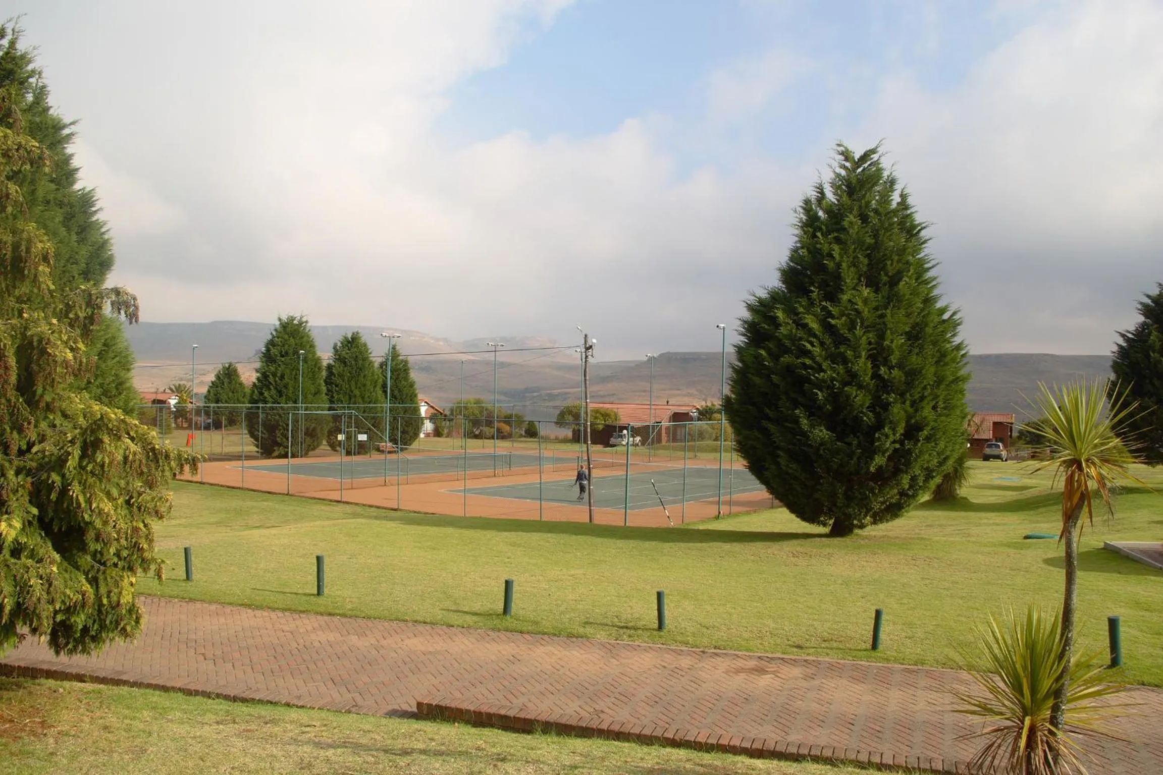 Tennis court in First Group Qwantani