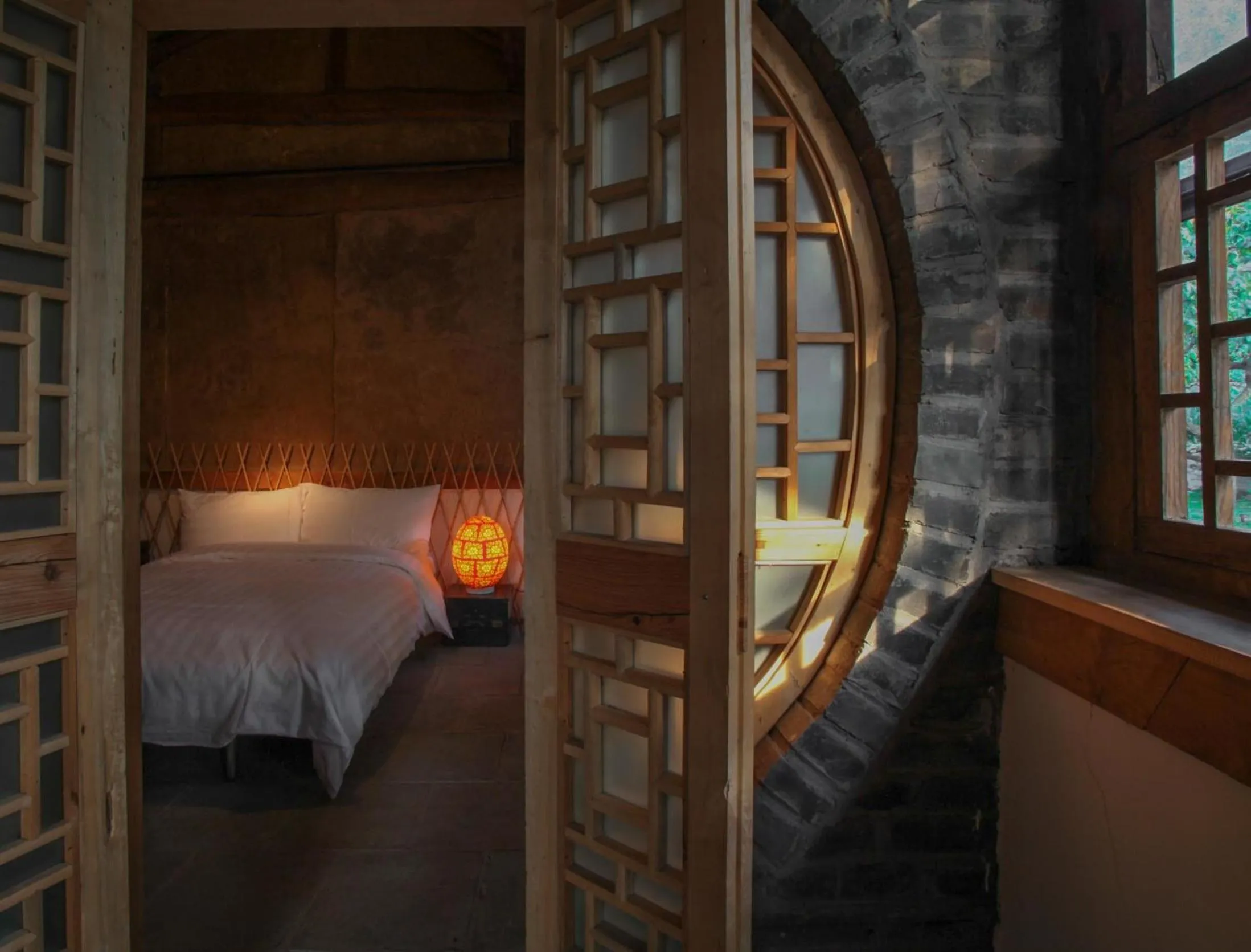 Photo of the whole room, Bed in Brickyard Retreat at Mutianyu Great Wall Adjoin to Mutianyu Great Wall - Room with the View of Great Wall - Jacuzzi with the View of Great Wall - Vehicle Shuttle Service - International Catering - SPA& Nail Beauty Facilities