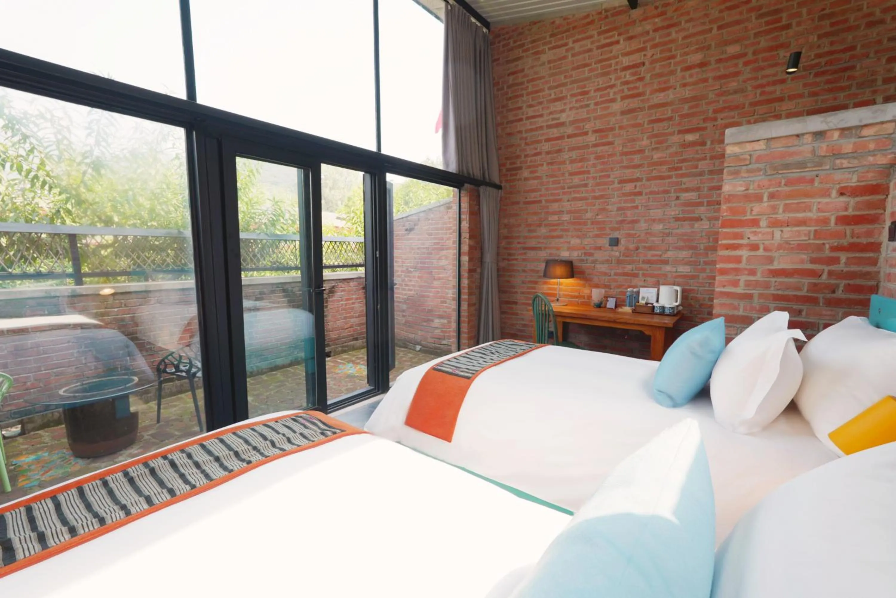 Bed in Brickyard Retreat at Mutianyu Great Wall Adjoin to Mutianyu Great Wall - Room with the View of Great Wall - Jacuzzi with the View of Great Wall - Vehicle Shuttle Service - International Catering - SPA& Nail Beauty Facilities