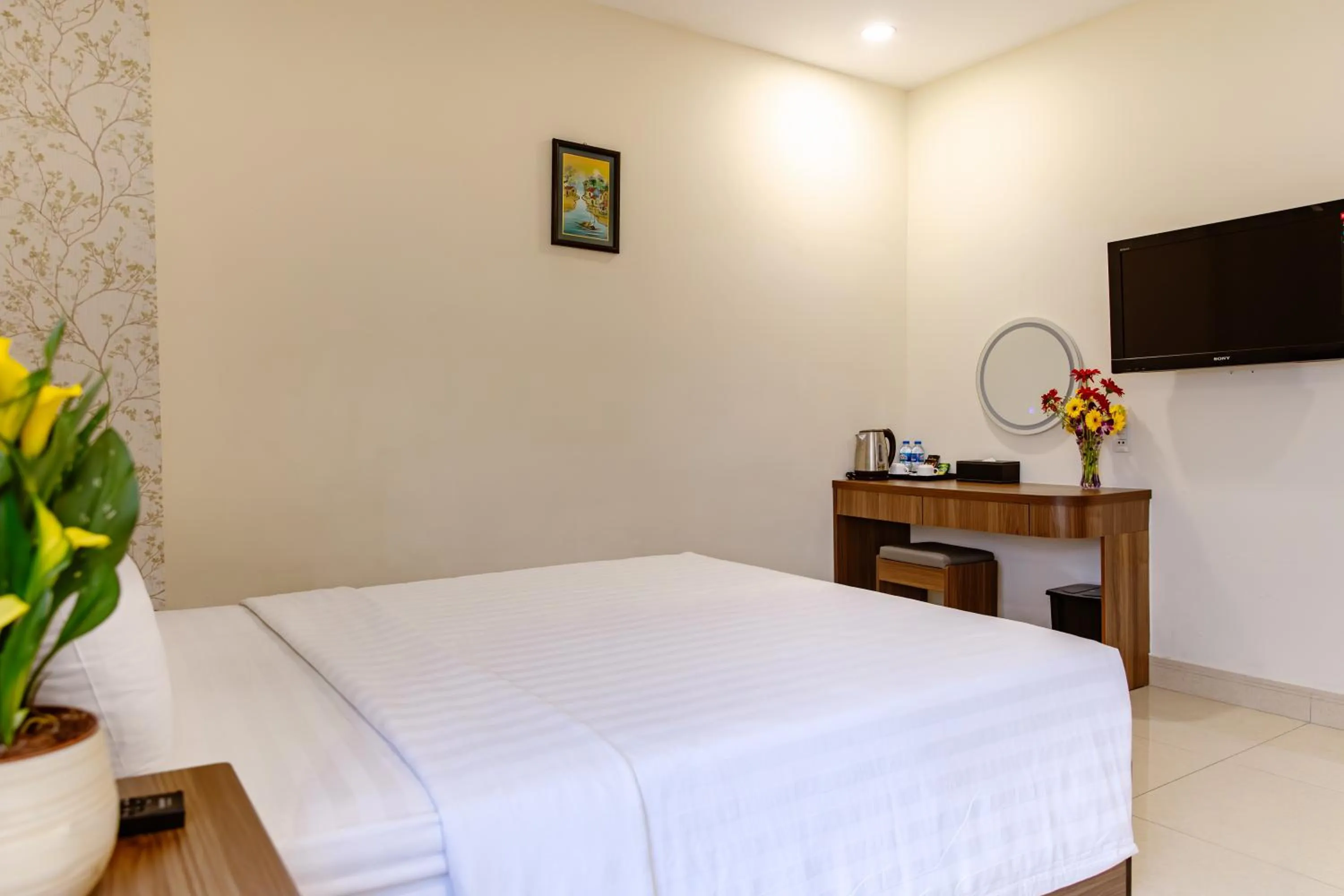 Bed in Boss Palace Hotel