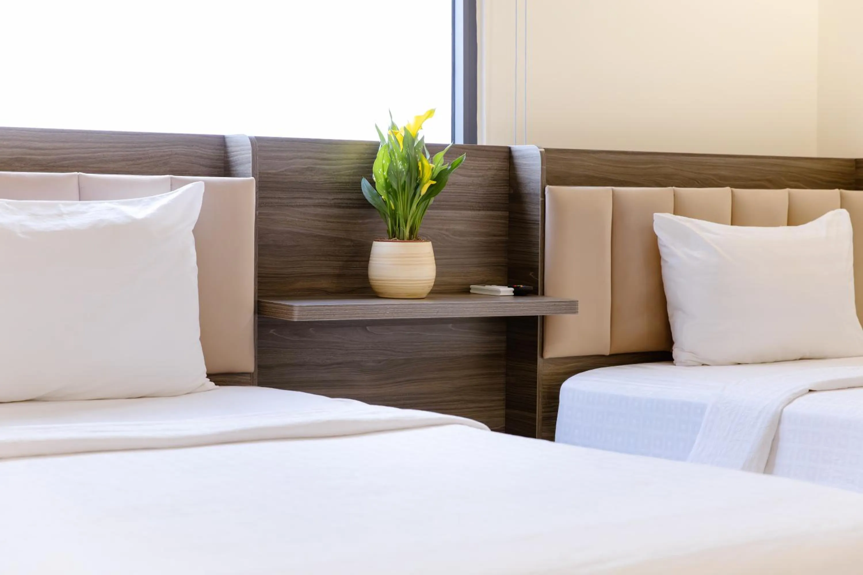 Bed in Boss Palace Hotel