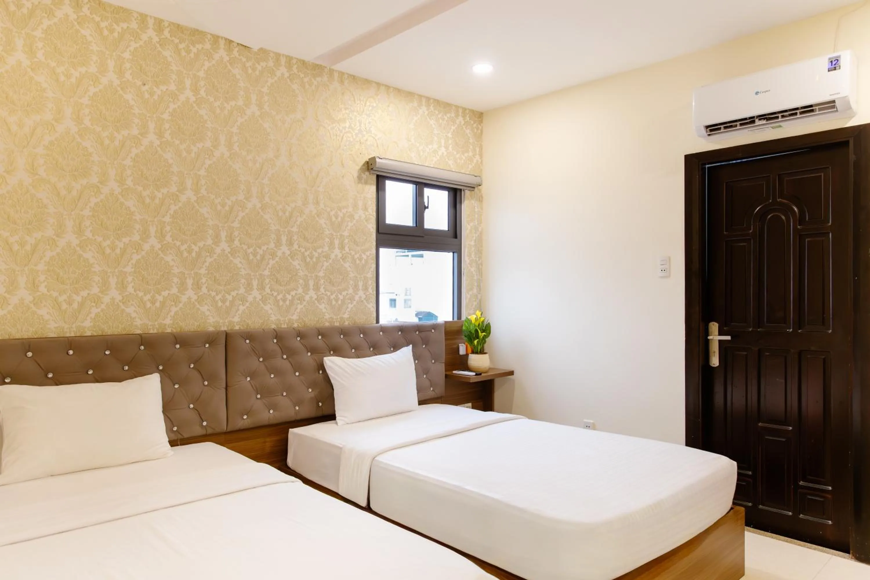 Bed in Boss Palace Hotel