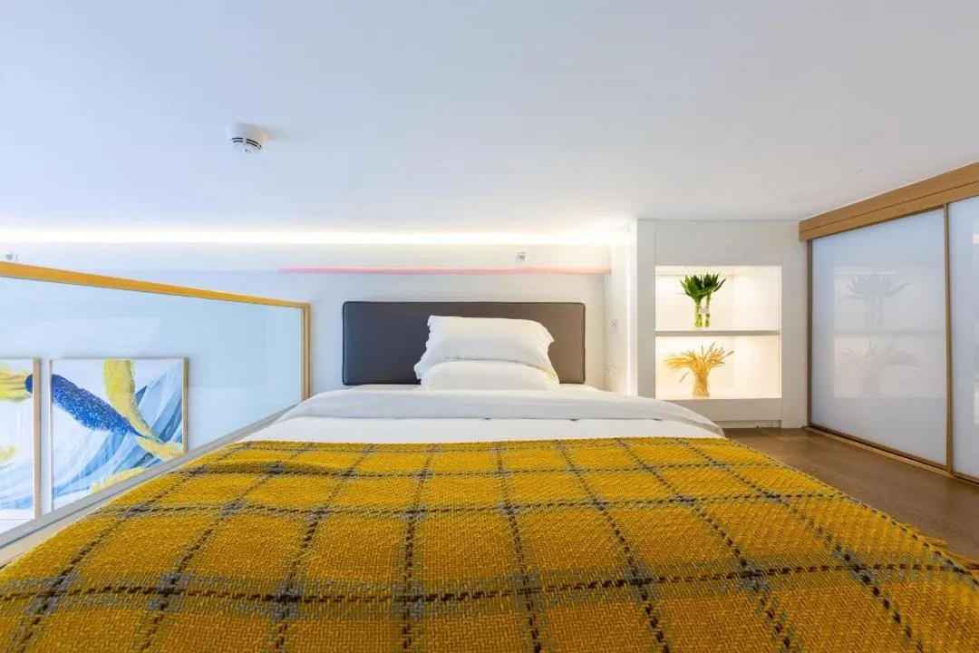 Bed in Guangzhou YuXiang Apartment - Guangzhou Pazhou International Convention and Exhibition Center