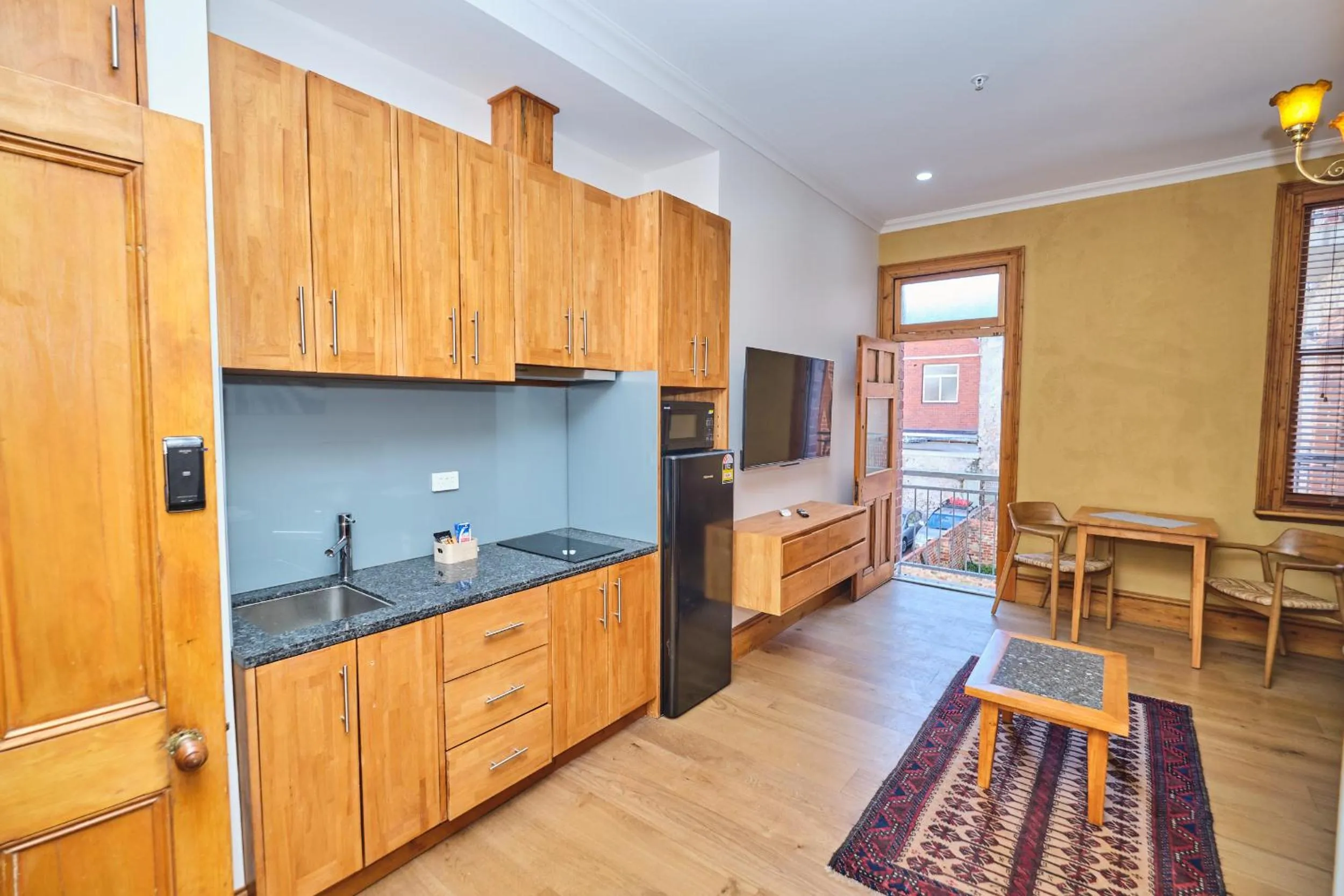 Kitchen or kitchenette in RIALTO SUITES Fremantle