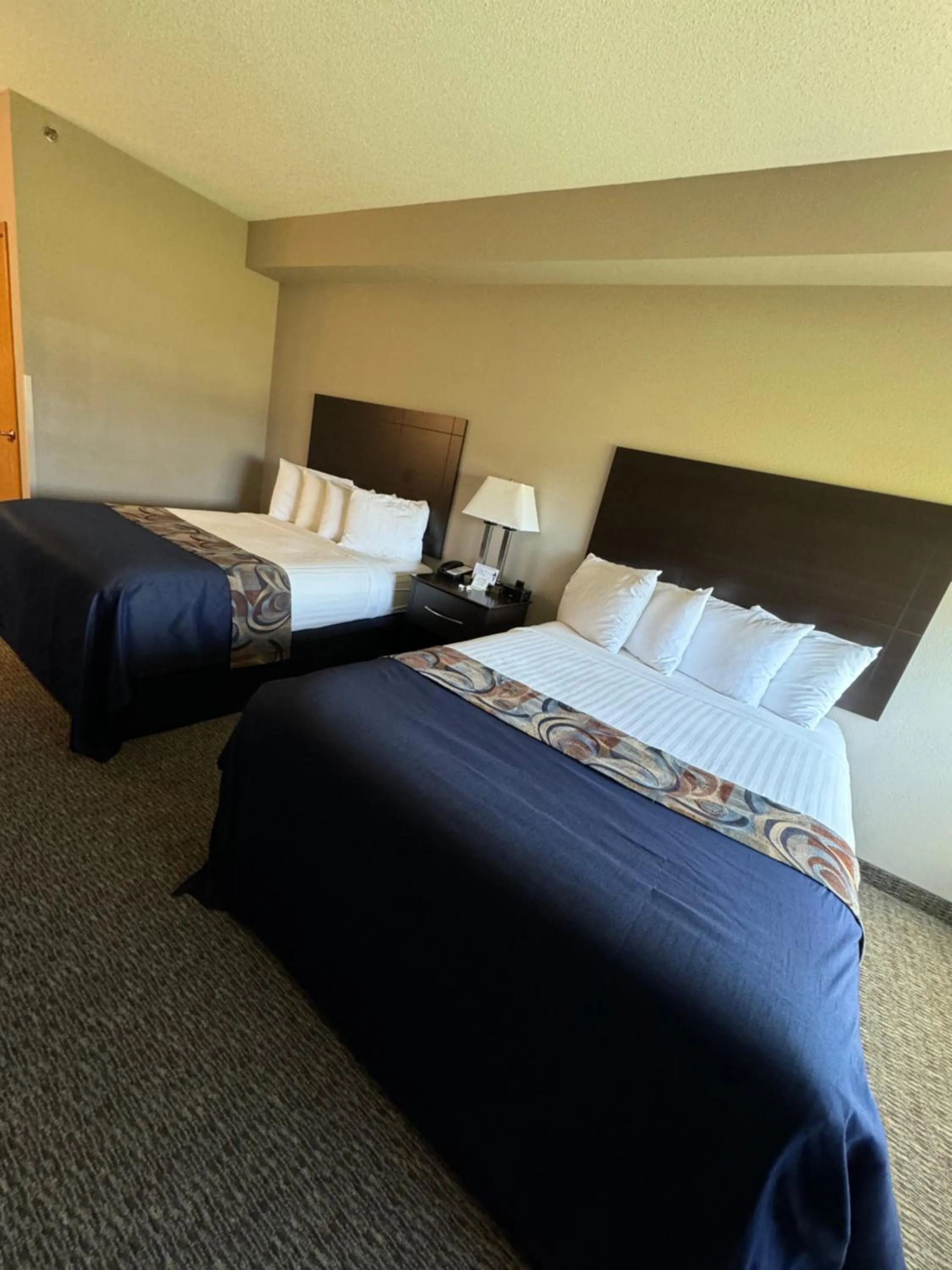 Bed in Garner INN & Suites