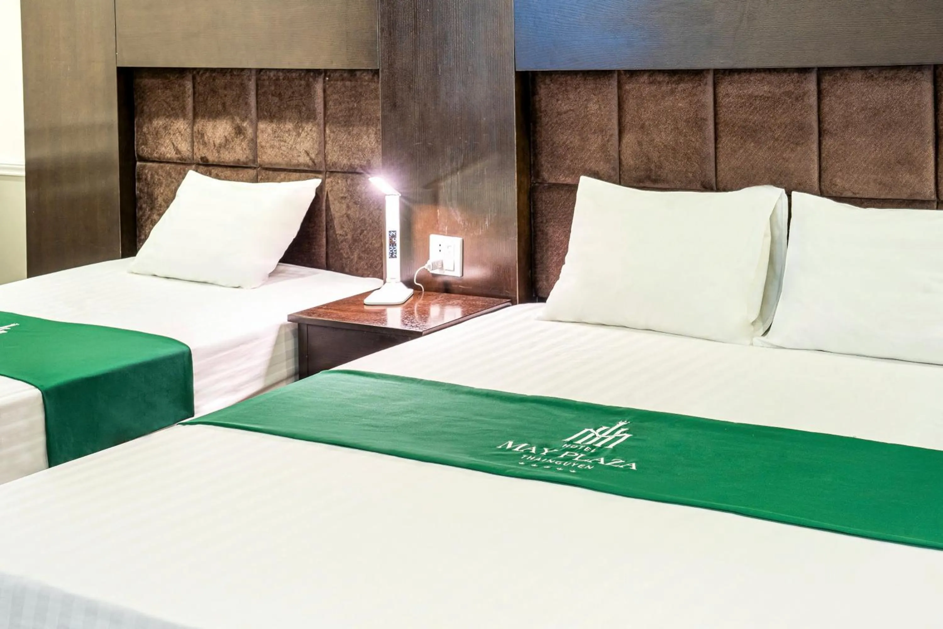 Bed in MAY PLAZA HOTEL