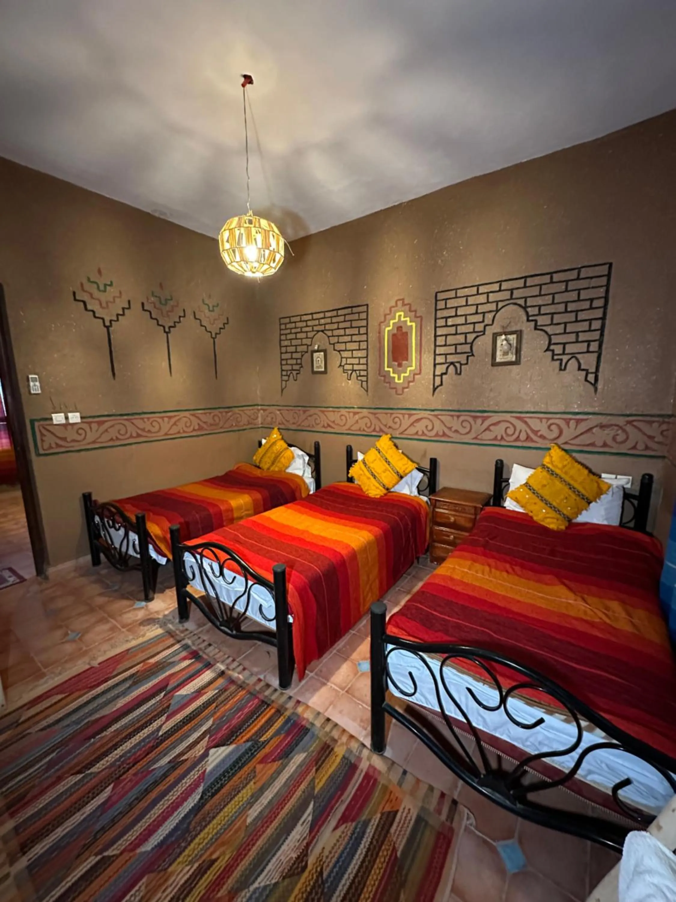 Bed in Riad Soleil du Monde