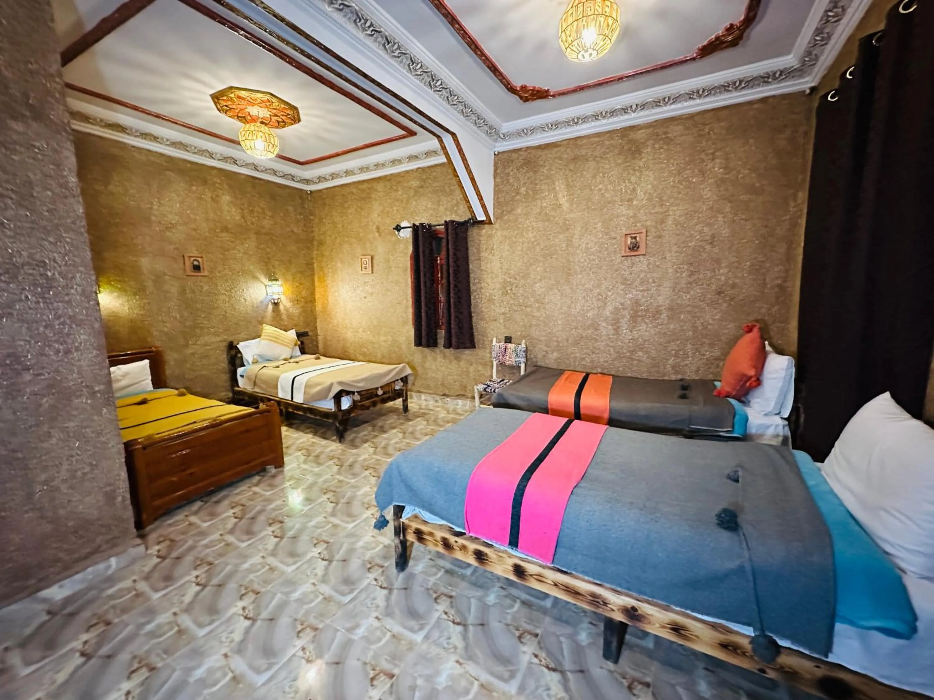 Bed in Riad Soleil du Monde