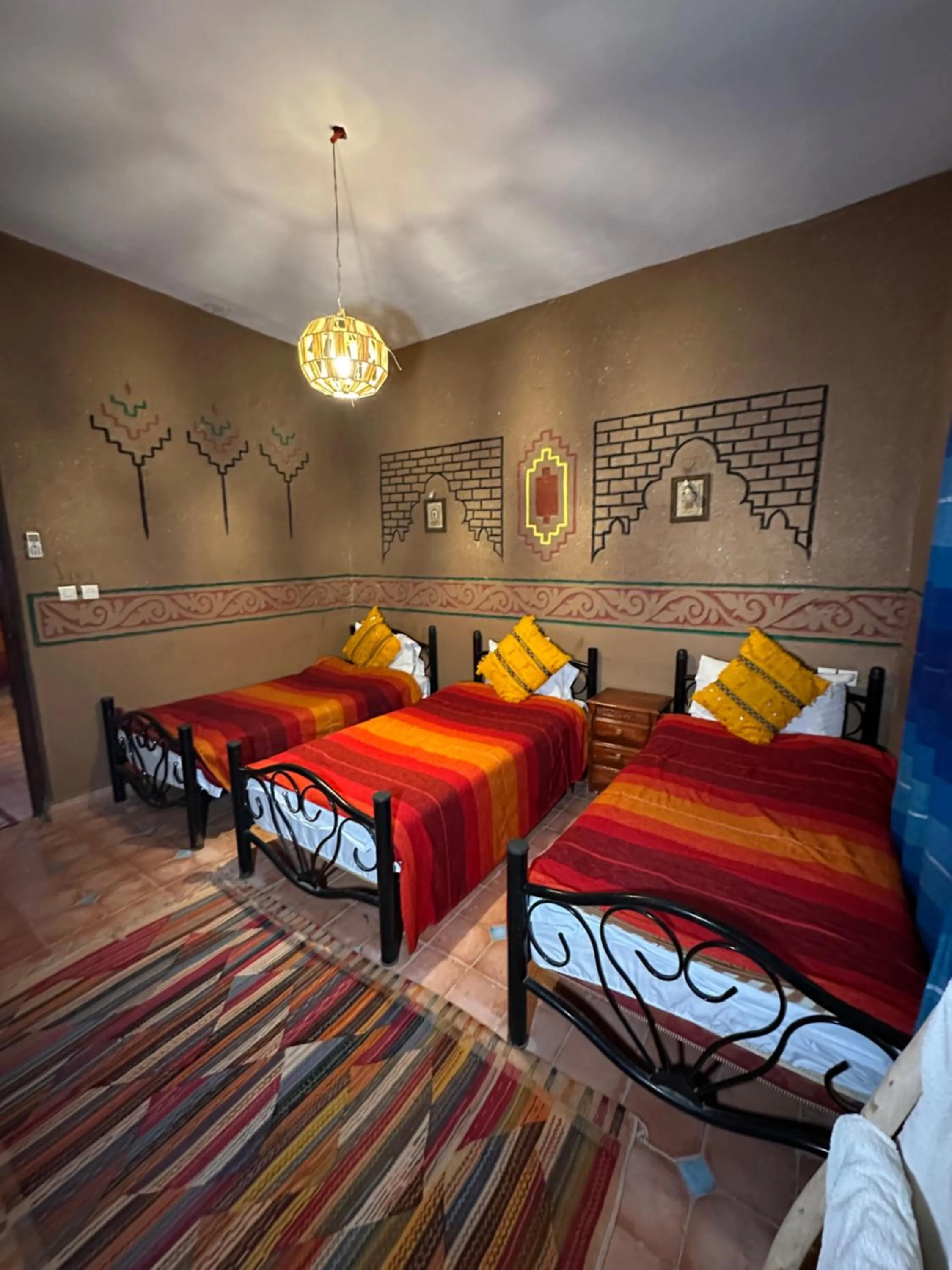 Bed in Riad Soleil du Monde