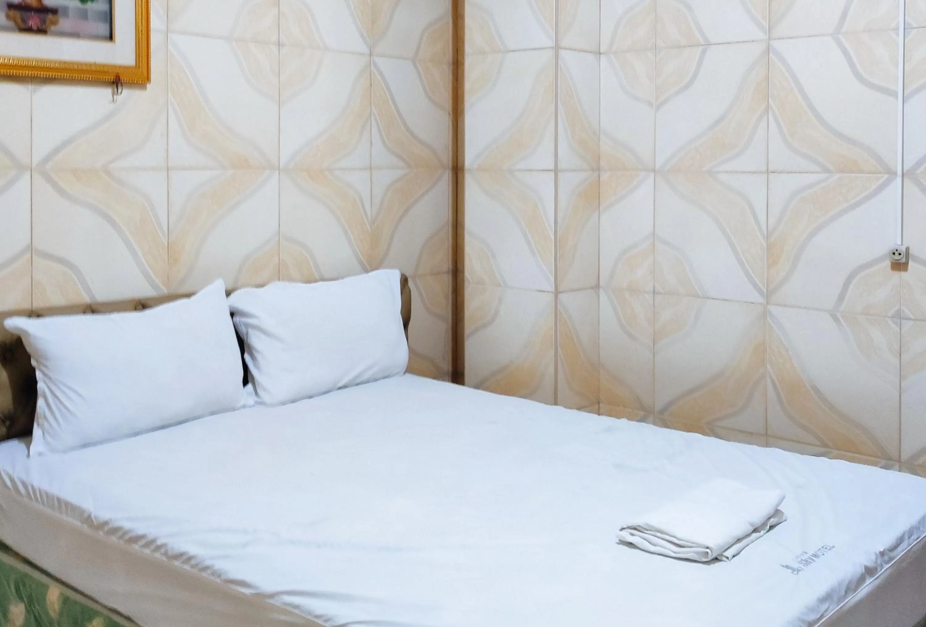 Bed in RedDoorz @ PVC Pension Haus