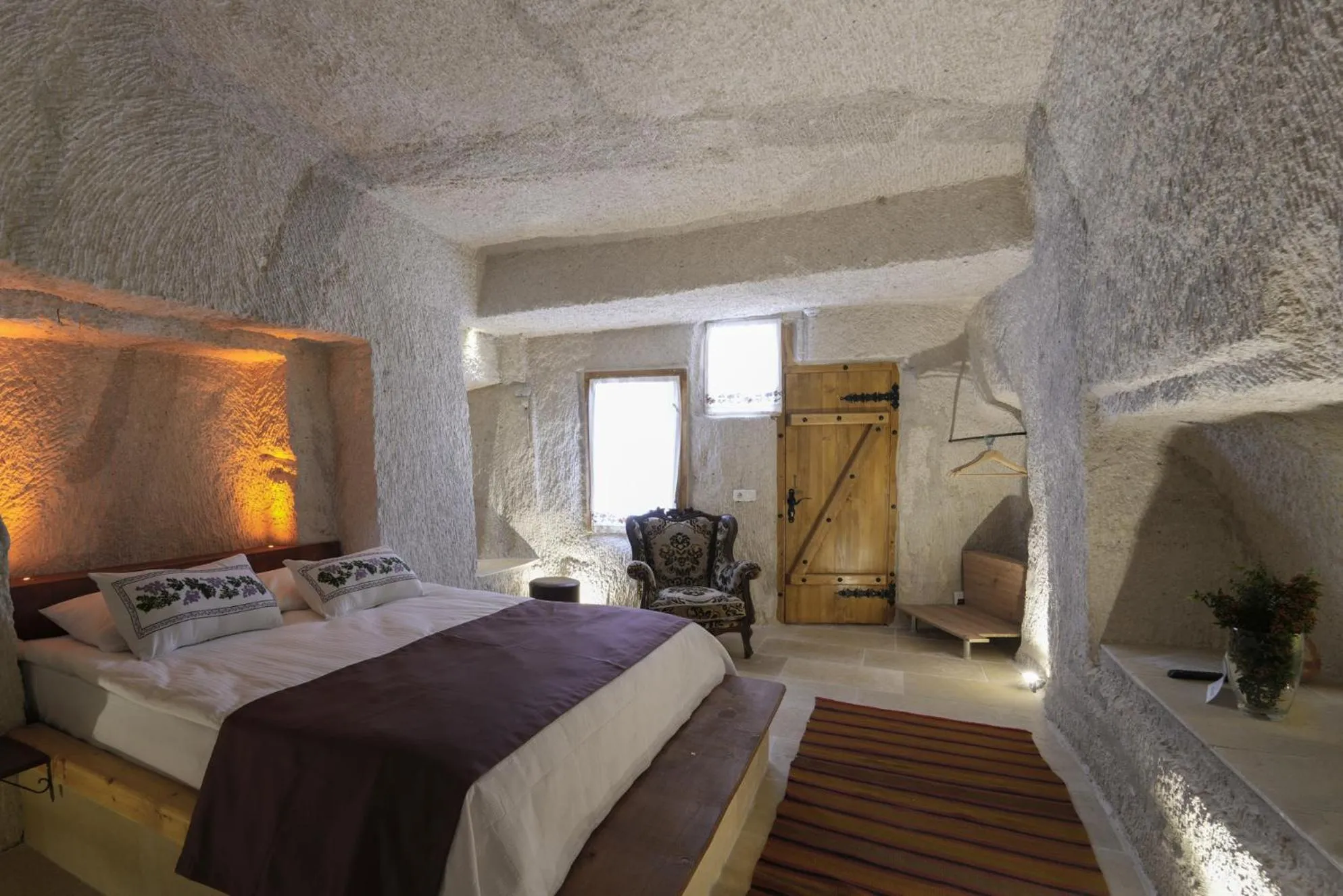 Seating area, Bed in My Cave Suites
