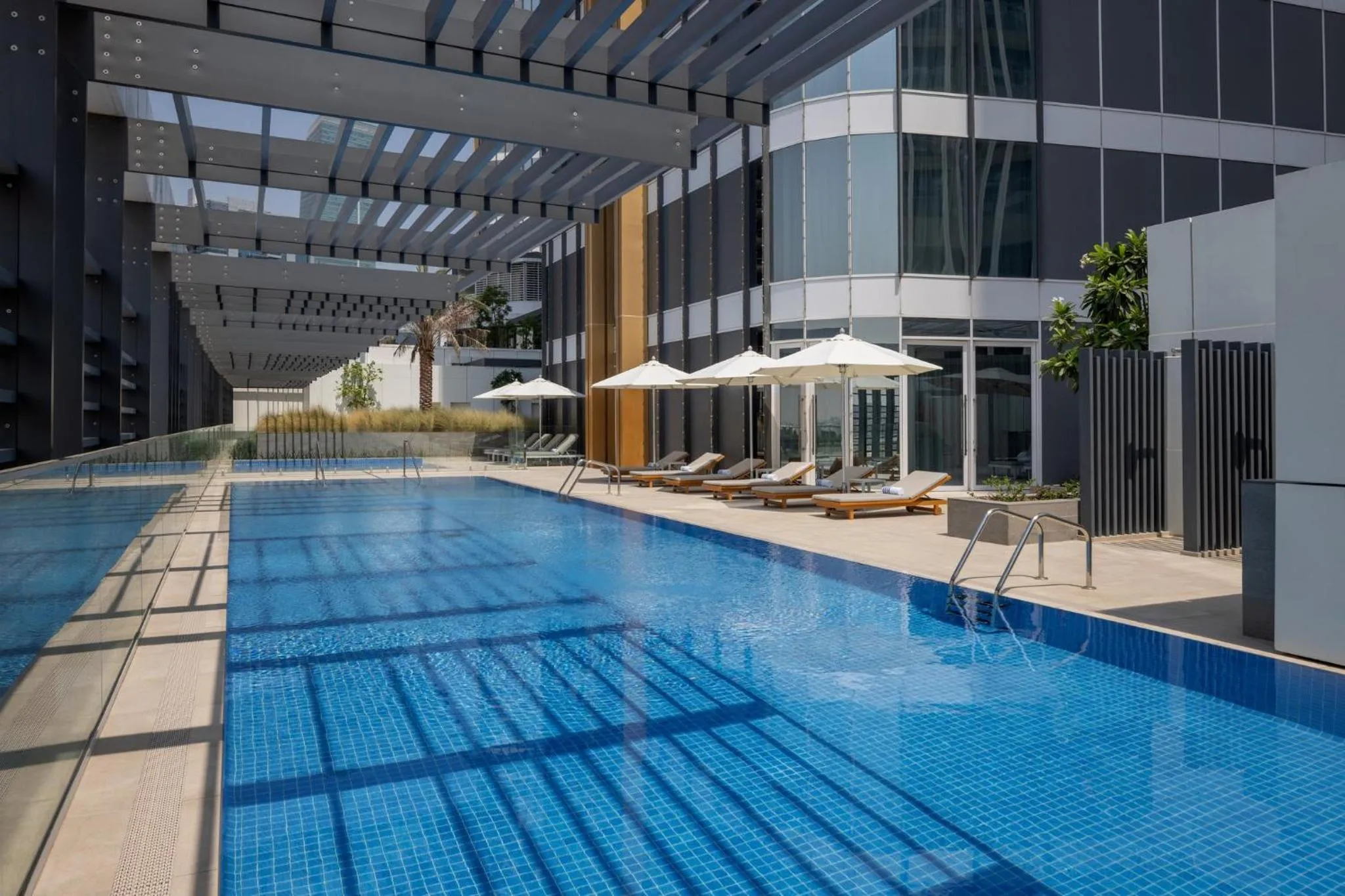 Swimming pool in Staybridge Suites Dubai Business Bay by IHG