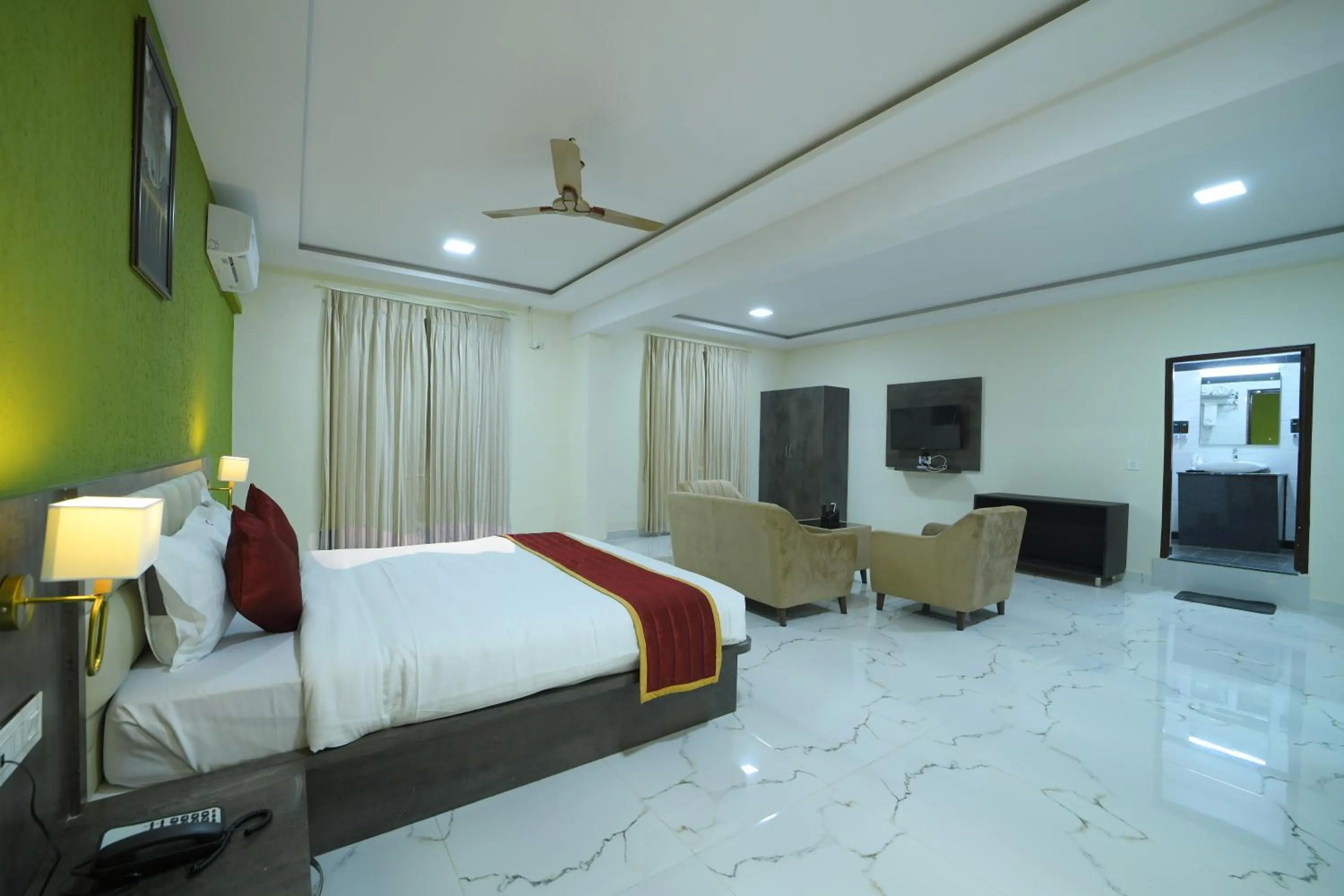 Bed in Hotel CN Windsor Chikmagaluru