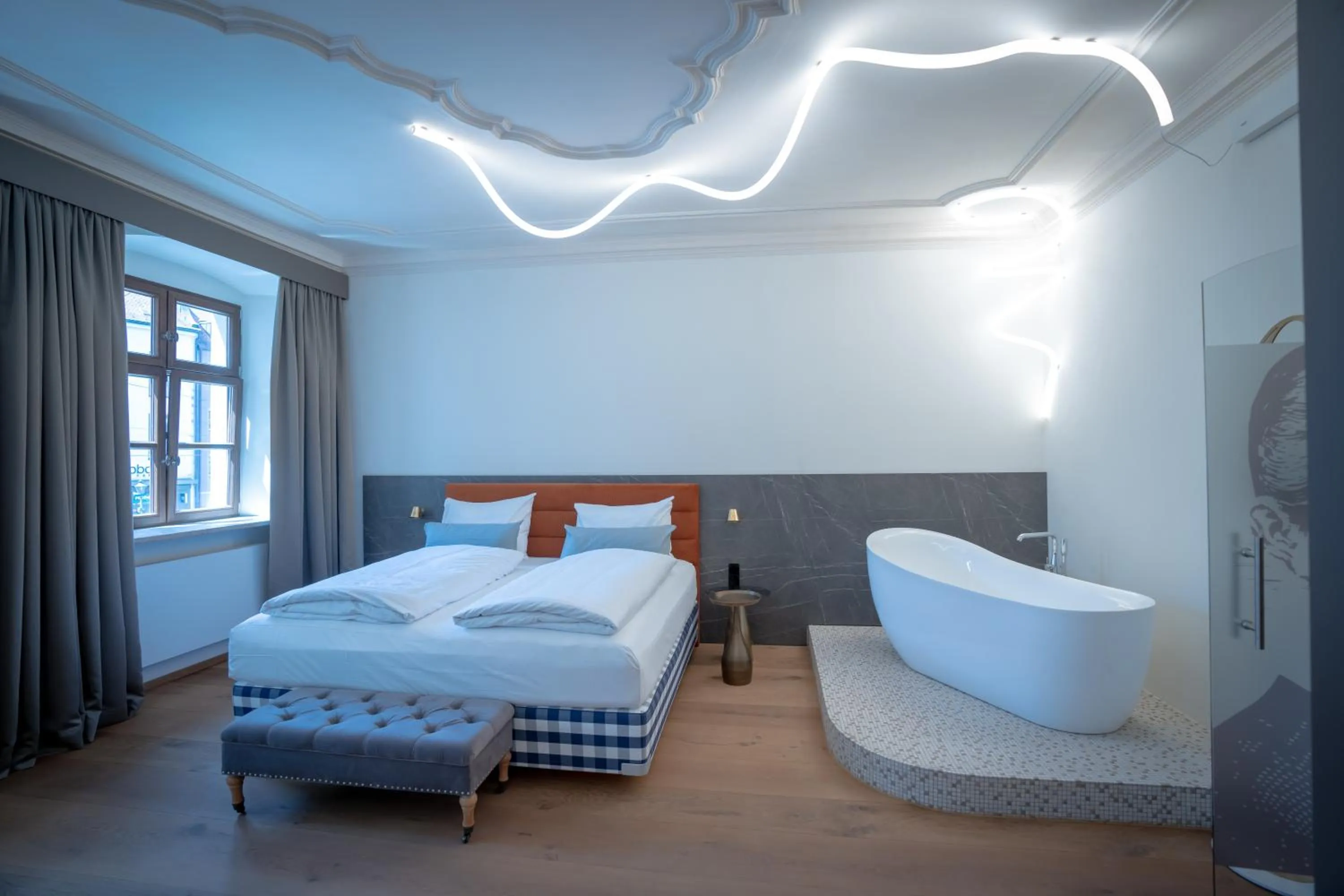 Photo of the whole room, Bed in Maxim Suites by Elias Holl