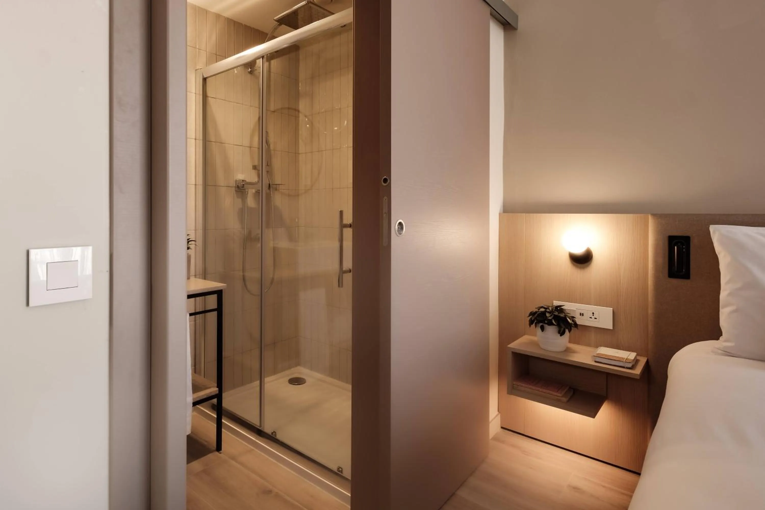 Shower, Bed in Strand Suites by NEU Collective