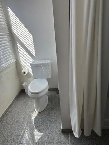 Toilet in Fountainview Inn